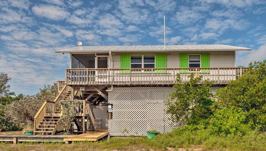 Off the beaten path, on the Bay waters, watch the day gently slip away. 3 day minimum to rent This 2-bedroom Bay view property is the ideal place to relax and get away from it all. No cars, no traffic, no hassles. Bird's Nest, our sister property, is also available for rent. Guests renting both units are eligible for a discount. Max group size is 13. Schedule the water taxi to take you back to old Florida...the island of Little Gasparilla is boat only access. Beautiful views from the screened in lanai, fully equipped kitchen, washer, and dryer on site. PET FRIENDLY with owner approval. Take a stroll to the PRIVATE BEACH. Laze by the warm Gulf waters and catch an amazing sunset., Community dock available for boats 22 feet or less.

Accommodates: 7 guests maximum with use of futons - Bird's Nest, our sister property is available for larger groups. Discounts available if both units are rented together. Combined, both units will accommodate upto 13 guests SUNDAY check ins must be approved. Beds: 1 Queen, Bunk Beds (single and full) and two futons. Amenities include: satellite WIFI - Air-conditioning, washer/dryer, linens included, microwave, toaster, coffeemaker - auto-drip, dishes/utensils provided, This property is equipped with two paddleboards, a kayak, 75 inch Smart TV, books, games, cornhole, darts, hammock, beach chairs and towels. Lots of extras to make you feel at home. BOAT ONLY ACCESS - barge landing is in front of the property

Extras: This property is equipped with a golf cart, two paddleboards, a kayak, 75 inch Smart TV, books, games, cornhole, darts, hammocks, beach chairs and towels. Lots of extras to make you feel at home. Pets allowed with permission and $150 fee Sorry, No Smoking. **Daily rates may be available. Contact us for details. Please note rates are subject to 12% tax, cleaning and reservation fee. $500.00 Refundable Security Deposit also required.

Located directly in between Sarasota and Ft. Myers on Southwest Florida's Gulf Coast, Little Gasparilla is as close as you can get to Old Florida! There are no paved roads or commercial establishments on the island, only miles of sandy trails flanked by tropical foliage. Take long leisurely walks to explore the beauty of the island. The peaceful, uncrowded beach provides plenty of room for you to bathe in the sun all day, enjoy outstanding shelling, bird watching, swimming, playing with your little ones, and beautiful water views, but best of all, the brilliant sunsets at the end of each perfect day. There is great fishing to be had in Placida Harbor for Snook, Trout, Redfish, Snapper and more, and in the world famous Boca Grande Pass you can try your hand at Tarpon fishing. Little Gasparilla Island is the ideal place to get away from the mainland madness. Come relax and unwind in a secluded tropical paradise. LGI is for those seeking a respite from the hectic pace of the mainland and the hassles of everyday life. Escape to Little Gasparilla Island where you can Stay a Week or a Lifetime! **PLEASE NOTE: This is a bridgeless, barrier island that is accessed by water taxi or private boat. Call us for details!