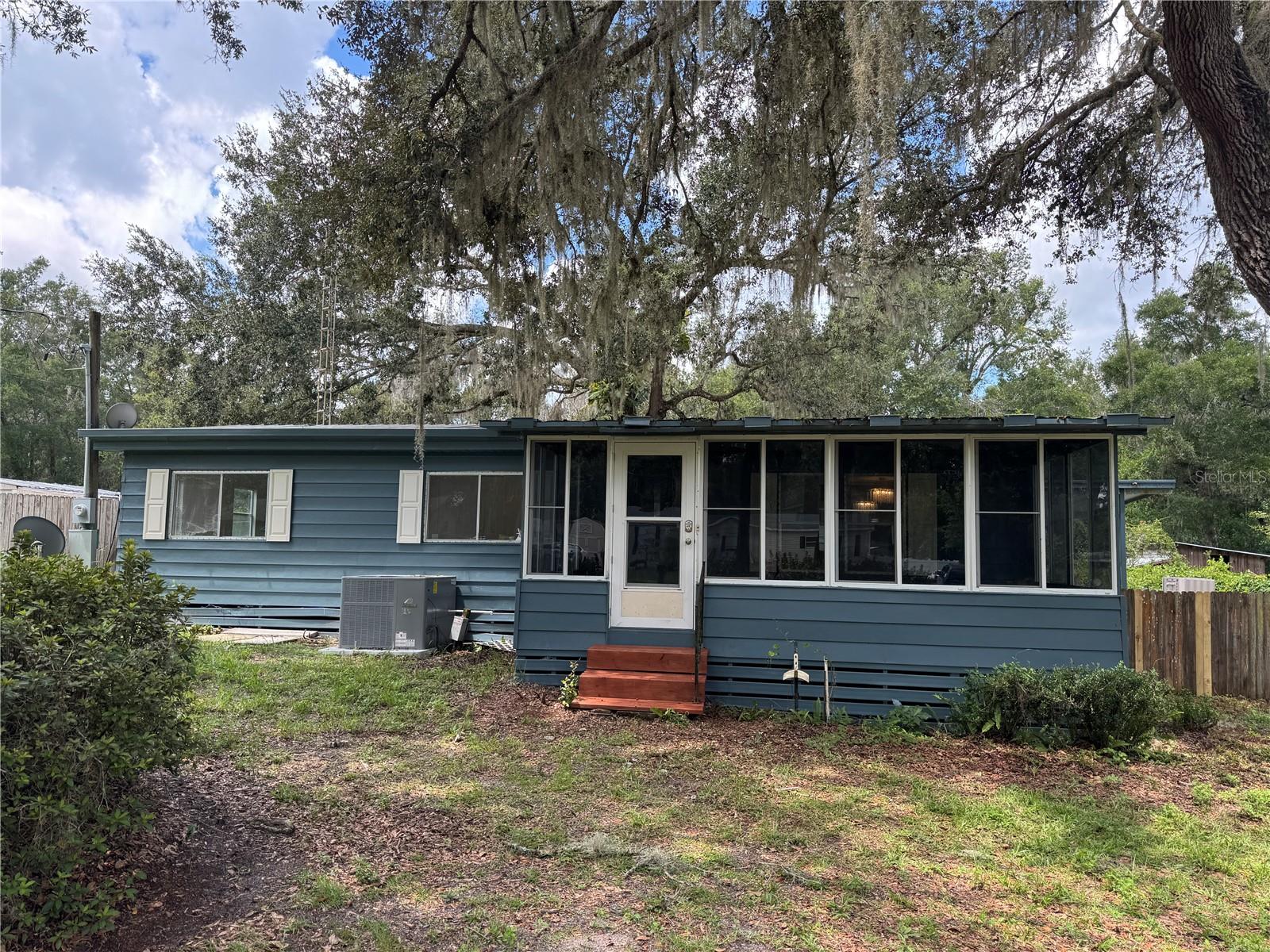 Move-in ready 2-bedroom, 2 bathroom manufactured home located on a quiet cul-de-sac in Floral City. Recently renovated, this bright and welcoming home features new stainless-steel appliances, washer and dryer, and an open layout filled with natural light. The large enclosed front porch and spacious back lanai provide the perfect spots to relax or entertain, overlooking a generous backyard with mature landscaping. A storage shed offers extra space for tools, hobbies, or a workshop. This home combines comfort, convenience, and a peaceful setting—ideal for tenants seeking a ready-to-enjoy Florida lifestyle. New roof will be installed in the next couple of weeks. Apply here: https://apply.link/5qov9KI