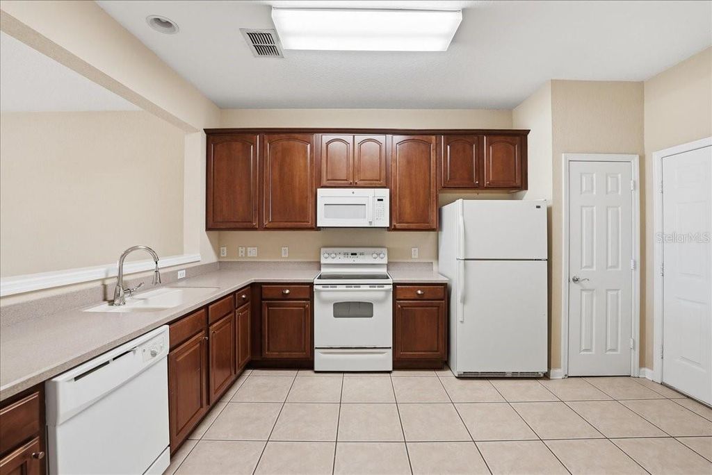 Photo of 2837 Villafuerte Point #103, Orlando, FL 32835 (MLS # O6398569)