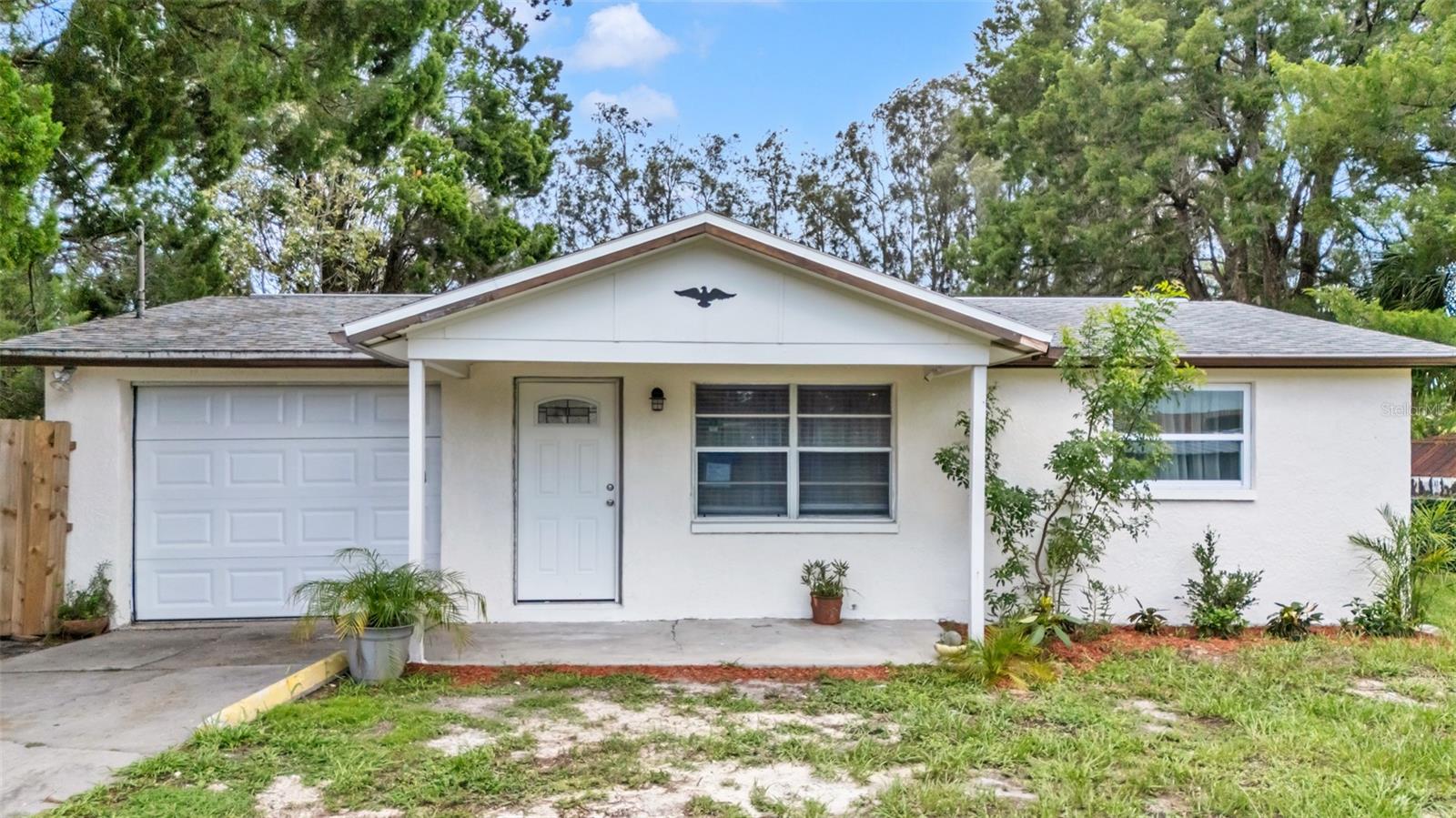 Welcome to this beautiful canal-front fully remodel home in Hudson, Florida. The fenced yard and charming porch welcome you into a bright living space with tile floors throughout and new recessed LED lights. The kitchen is brand new and overlooks the canal, and there are two comfortable bedrooms with brand new laminate and 1 full bathroom inside the home. With another partial bathroom located in the garage coupled with the washer and dryer that are also included. Central air ensure year-round comfort with an brand new AC . Also featuring ew duct work and new electric throughout. Enjoy the fenced backyard with stunning water view! Take your kayaks fishing or sight seeing directly to the open Gulf of Mexico! With access to the Gulf just blocks away, this home offers the perfect blend of comfort and waterfront living for an amazing price! Schedule a showing today before it's too late! Close by to shopping, schools, restaurants and much more!