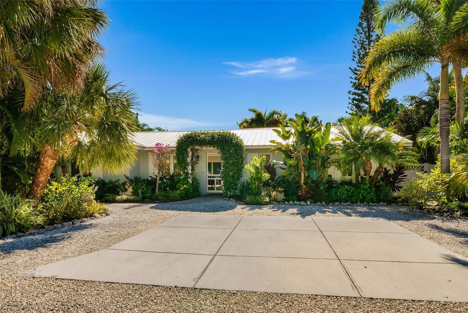 This completely updated Anna Maria Island 3 bedroom 2.5 Bathroom pool home is situated on a cul-de-sac, and features hurricane-rated windows, metal roof, concrete block construction and garage. Property is in a Weekly rental zone of Holmes Beach, making this BEAUTIFUL BEACH HOME a perfect investment property, or family get away. Just 3 short blocks to the white sandy beaches of the GULF OF MEXICO and walkable to restaurants, establishments offering live music and charming shops making driving optional once you arrive! The kitchen and great room features an entire wall of sliding doors opening to the sunny south-facing outdoor living space and heated pool. The Master Retreat also opens to the pool area and features a master bath with walk-in shower, dual sink vanity and walk-in closet. A second Master suite and an additional 3rd bedroom with custom built in bunks make this gorgeous home spacious and functional for your family to comfortably relax both indoors and out. New Kitchen, new appliances, new bathroom vanities, new light fixtures, new pool equipment… and situated on an oversized lot, with an oasis backyard surrounded by tropical landscaping, paver decking, and a heated pool. Home is being sold TURN KEY FURNISHED with decorator finishes! This one won't last!