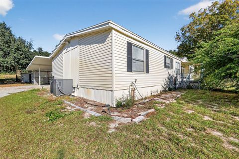 Photo of 11911 Lane Park Rd, Tavares, FL 32778 (MLS # G5105471)
