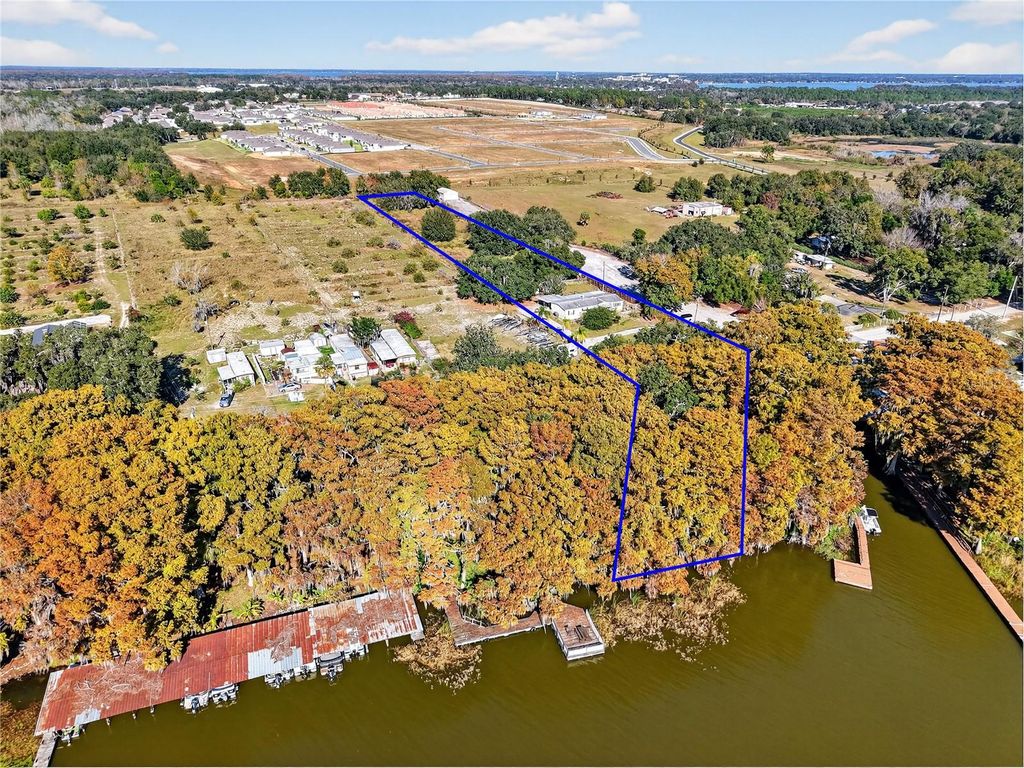 Photo of 11911 Lane Park Rd, Tavares, FL 32778 (MLS # G5105471)