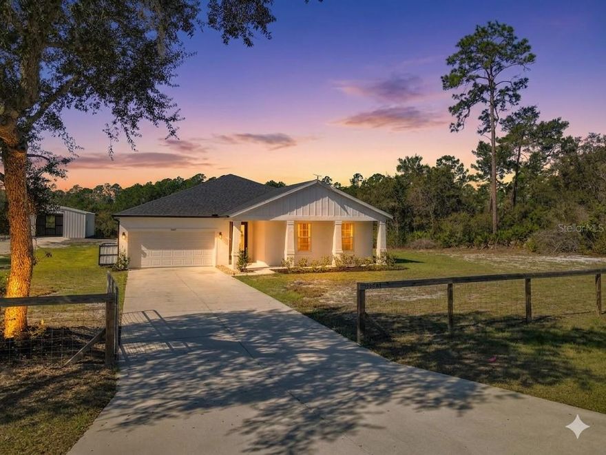 NEW PRICE IMPROVEMENT! Rare Find!! Modern Farmhouse Luxury + Ultimate 936 SqFt Custom Workshop on 1.5+ Waterfront Acres!

Skip the cookie-cutter neighborhoods. Welcome to your ultra-private oasis where you will never have front or rear neighbors! Fronting a beautiful state-protected preserve and backing up to a serene pond, this nearly-new 2023 build offers the peaceful, unrestricted lifestyle you’ve been looking for.

The crown jewel of this property is the brand-new, $50,000+ custom metal workshop added in 2025. Complete with its own dedicated driveway, this is a dream setup for car collectors, RV/boat owners, hobbyists, or mechanics.

?? Inside the Home (2023 Build):
Modern Farmhouse Elegance: Light, bright, and open-concept living.
Chef’s Kitchen: Stunning quartz countertops, 42" soft-close cabinets, and a massive island perfect for entertaining.
Spacious & Airy: Soaring 9’ to 10’ ceilings throughout the home.
Premium Upgrades: Includes a whole-home water softener and newly installed 6” seamless gutters.

??? The Workshop & Grounds:
The Ultimate Toy Garage: 26’ x 36’ (936 SqFt) custom metal building with towering 10’3” ceilings, giant rolling door and a wide-open interior.
Bring Everything: Absolutely NO parking restrictions for your RVs, boats, work trucks, or utility trailers.
Guaranteed Privacy: Enjoy your morning coffee on your wide front porch viewing the preserve, and your evening gazing at sunsets and spotting wildlife around the pond.

?? Community & Lifestyle:
Equestrian Friendly: Zoned for horses!
Water Access: Enjoy deeded access to beautiful and natural Lake Norris.
Incredible Value: All of this with a remarkably low HOA of just $92/year.

Why wait to build from scratch when you can have a fully upgraded, move-in-ready home with a massive custom workshop already completed? Schedule your private tour today before this unique estate is gone!