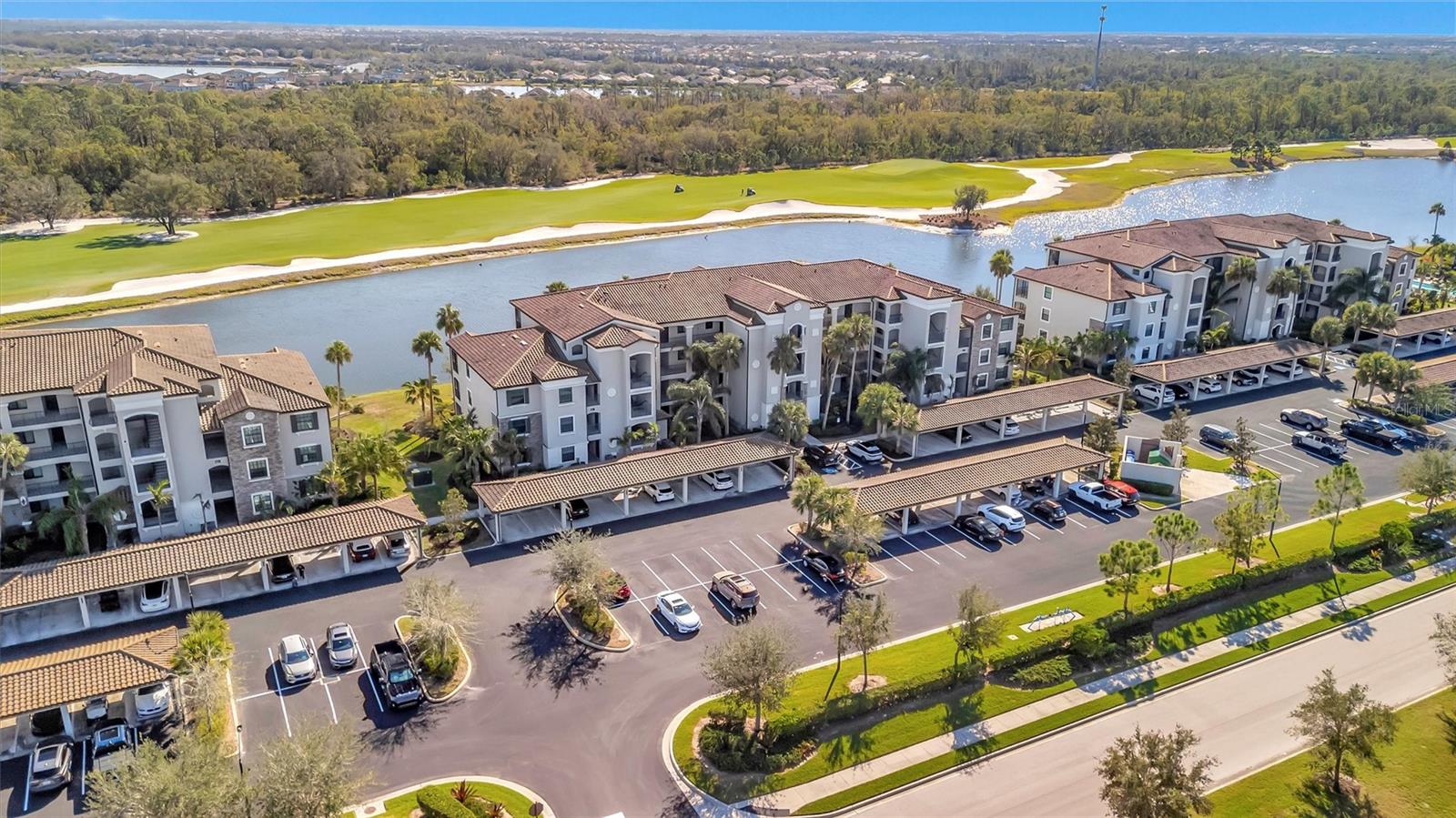 This is a rare find, 3-bedroom, end unit, split bedroom floorpan with unobstructed water and golf course views. Being sold TURNKEY FURNISHED in the gated maintenance free community of Lakewood National Golf Club. Condo fee INCLUDES MEMBERSHIP to a 36-hole Arnold Palmer-designed golf course, internet, cable, water, sewer, and trash. As an end building you have amazing views from the great room and lanai with plenty of natural light coming from the extra windows that comes with only this floor plan. The Kitchen offers stainless steel appliances, solid wood cabinets and granite countertops. Lakewood National is a gated community with 24-hour manned guard gate, a luxurious clubhouse with fine dining, a tiki bar, and a state-of-the-art fitness center. Residents have access to luxury spa services as well as tennis, Pickleball and bocce courts. The location with easy access to downtown Lakewood Ranch, sports facilities, shopping, dining, and top-rated schools. Lakewood Ranch has been the #1 Multi-generational planned community for six years running. Come see why so many have chosen to call this place home.