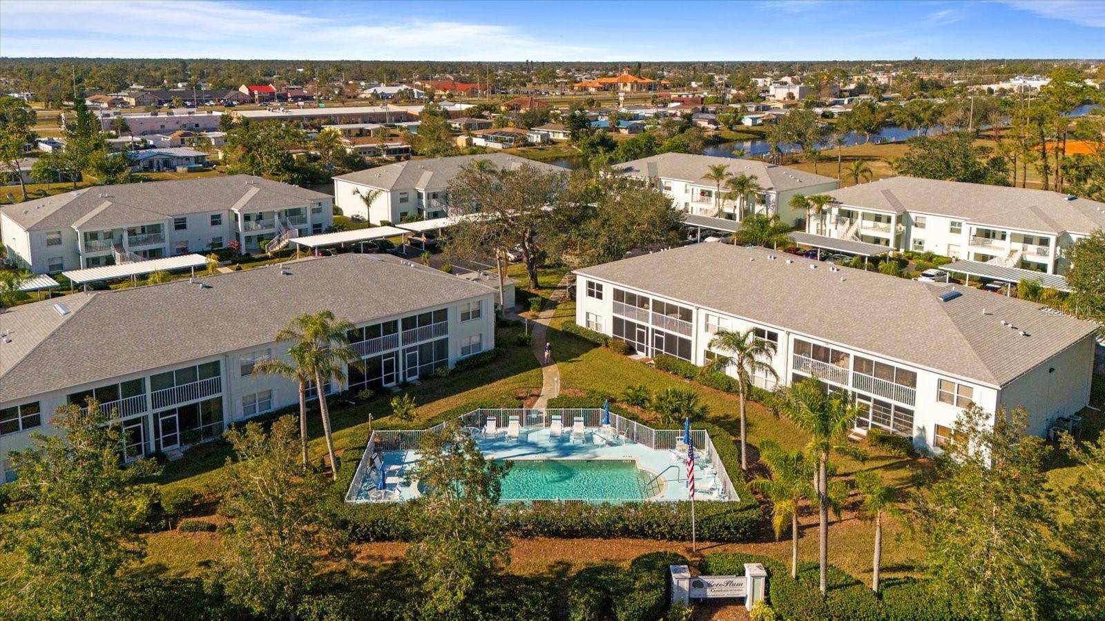 Motivated sellers...Fully Furnished!!! View this property with the 3D tour. Welcome to your beautifully maintained 2nd-floor condo in the desirable 55+ community of Cocoplum! This 2BR/2BA home is ideal as a seasonal escape or year-round retreat. This comes fully furnished so no need to spend lots of money for furniture. Featuring soaring cathedral ceilings, stylish tile and engineered wood flooring throughout (no carpet!), and a fully updated kitchen with sleek granite countertops, this condo offers both luxury and comfort. Plus, enjoy peace of mind with impact windows for added safety. Start your day with coffee in the cozy breakfast nook or on the lanai with a serene view. The spacious living and dining areas are perfect for entertaining friends and family, and the screened-in tiled lanai provides a private Preserve view with sliding doors and sun shades perfect for enjoying year-round. The condo is painted in soft coastal hues and features elegant plantation shutters throughout. The master suite offers a walk-in closet and a lovely bathroom. The guest bedroom also features engineered wood flooring, and the guest bath includes a tub/shower combo. The well-designed split floor plan ensures privacy for both you and your guests. Recent updates include a new roof on the building, providing peace of mind. Enjoy low monthly condo fees that cover city water/sewer and pest control. An assigned carport parking space is included for added convenience. The community pool is the perfect place to relax, swim, sunbathe, and socialize. Conveniently located near pristine beaches, shopping, dining, and the Atlanta Braves Spring Training stadium. No CDD fees! And, you can bring your furry friend (up to 15 lbs). Don’t miss the opportunity to make this charming condo your own slice of paradise!