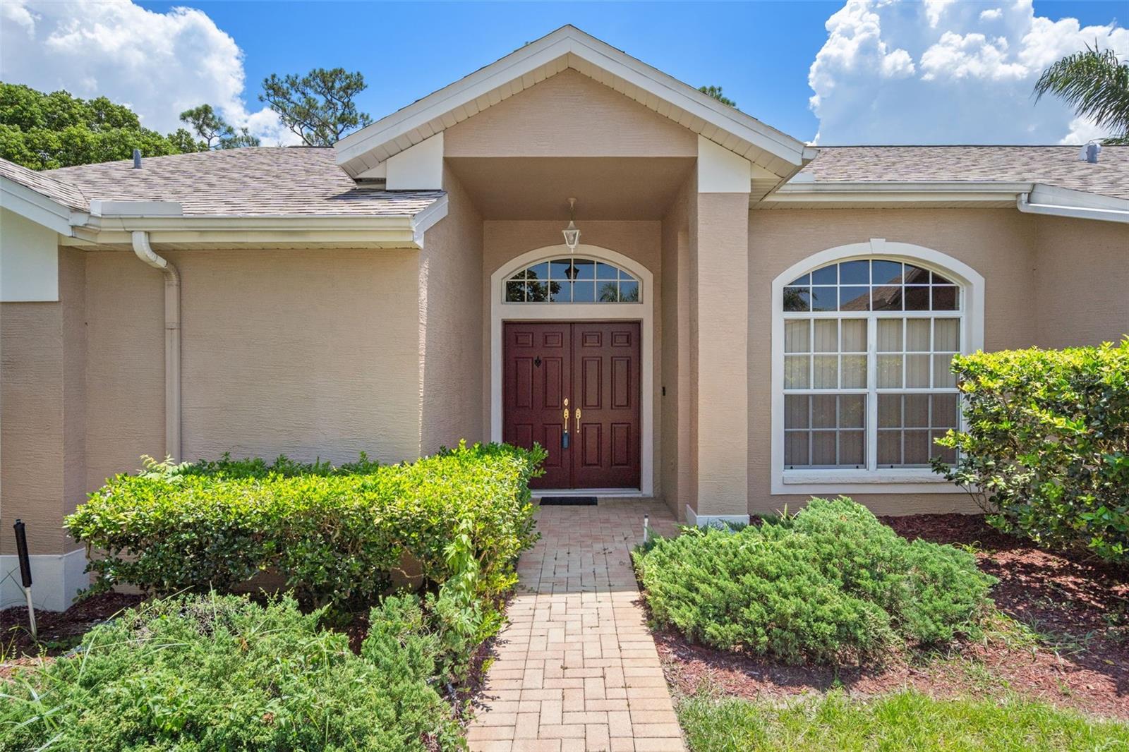 Looking for a split bedroom, pool home with vaulted ceilings, open kitchen to family room and breakfast nook? – This home is for you. It offers 1997 SF of ideal design. This 3BR/2BA home has a primary bedroom (on opposite side from others) that opens to pool lanai covered with pavers; an en-suite his and her walk-in closets; garden tub and walk-in shower. The living room has triple sliders that open to the pool lanai, along with the breakfast nook sliders which is great for flow when entertaining. The 2 car garage has entry through the inside laundry room with utility sink straight to the kitchen. The kitchen opens to the family room and breakfast nook (which also opens to the pool lanai) and breakfast bar. Separate pantry is stand-alone with easy access. The screened in pool area has a covered area in addition to an open area, which is great for BBQing and entertaining. Fairway Oaks offers low HOA fees; ZONED X - NO FLOOD INS REQ; sidewalks and convenient access to shopping, dining, hospital, Suncoast Parkway with straight shot to Tampa. Don’t miss the opportunity to view this home. Seller is motivated to sell.