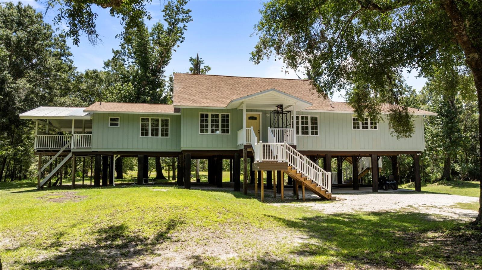 RIVERFRONT RETREAT on over 7 acres in Arcadia! Completely remodeled in 2023, this beautifully updated home blends natural beauty with updated style and convenience. Set on over 7 acres, with a long winding driveway that welcomes you to your own private retreat. Inside, you’ll find an open airy home that flows from kitchen to dining room to living room, making it a perfect set up for gathering with family and entertaining! Elegant finishes throughout the home include granite countertops, custom cabinetry, stainless steel appliances, and wood-look tile flooring that brings warmth and style to every room.
Step outside and experience the serenity of true Florida living. Relax on the back porch with your morning coffee or evening glass of wine as you take in the peaceful sights and sounds of nature. A gentle creek winds through the property with a foot bridge, and you'll enjoy 300 feet of direct access to the Peace River! Get ready for kayaking, canoeing, fishing, fossil hunting or simply soaking in the beauty of the water. For added functionality, the property includes a 30x20 metal garage, perfect for storage, a workshop, or hobby space, as well as a 20x20 carport with a concrete slab for convenient covered parking.
This property is a haven for wildlife lovers, with frequent sightings of deer and native birds, adding to the quiet magic of the setting. Whether you're exploring the woods, casting a line in the river, or watching the sunset from your porch, every moment here feels like a step back in time where life slows down and nature takes center stage.