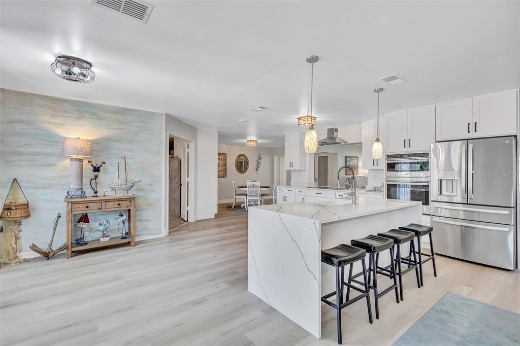 Photo of 563 Lewis Boulevard SE, St Petersburg, FL 33705 (MLS # TB8560989)
