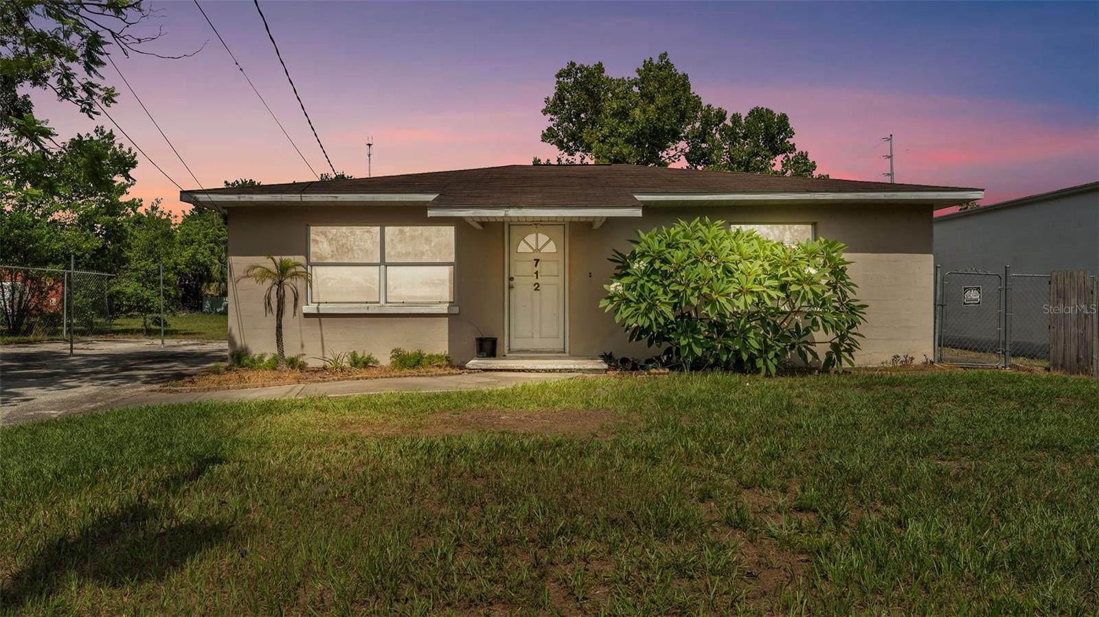 Exceptional opportunity to own a flexible-use property in a prime location—just minutes from downtown Lakeland and with easy access to major thoroughfares. This unique offering includes two adjacent parcels zoned C-2 (Highway Commercial), allowing for a wide range of residential or commercial uses. Whether you're looking to establish a professional office, live and work on-site, or invest in a centrally located property with development potential, this location checks all the boxes. This 2/1 home has great bones, stainless steel appliances, a BRAND NEW Roof will be put on prior to closing, a huge lanai, laundry room, and more! Don't let this unique opportunity pass you by, schedule a tour today!
