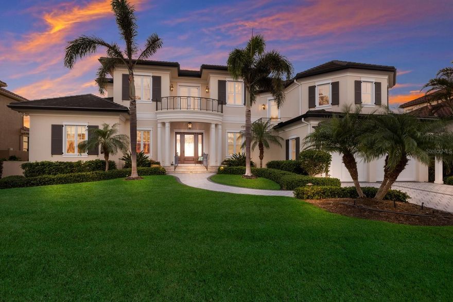 This exceptional Bayfront residence is perfectly positioned in one of Bird Key’s most sought-after locations, offering breathtaking western-facing views of Sarasota Bay from a quiet cul-de-sac. Custom-built in 2017 by renowned builder Murray Homes, this home exemplifies superior craftsmanship, thoughtful design, and exquisite finishes. From the moment you arrive, this well-appointed home makes a striking impression with its manicured front lawn, lush landscaping, and impeccable curb appeal. Inside, natural light floods the space, drawing attention to the panoramic water views through expansive walls of glass. The open-concept split floor plan seamlessly blends well-defined yet flowing living areas, striking an effortless balance of comfort and elegance. The chef’s kitchen, designed for both function and style, flows seamlessly into the family room and informal dining area, making it ideal for both everyday living and entertaining. A formal living room with a gas fireplace and a separate dining room add a refined touch, while the office with custom built-ins provides a peaceful workspace. The primary suite on the main level, features direct terrace access and serene Bay views. Ascending the staircase or taking the elevator to the second floor, where two guest suites with en-suite bathrooms offer comfort and privacy. A sitting area and informal dining space open onto what is arguably the most captivating part of the home—a large, west-facing terrace that showcases unrivaled waterfront views and breathtaking sunsets over Lido Key. Additional features of this custom-built home include a spacious mezzanine-level room, which has been used as a hobby space and can easily be converted into a fourth bedroom with its own bathroom and walk-in closet (image is digitally staged). The owner has remodeling plans and quotes available to share with prospective buyers. There is also a large dedicated internal storage room that can be utilized as a second office, playroom, gym, or art studio. Unexpected in size, the large laundry room offers incredible versatility and has been used as a sewing room, office, and laundry combination. Designed for Sarasota’s signature indoor-outdoor lifestyle, the exterior living spaces are equally impressive. A modern saltwater pool with a spillover hot tub takes center stage, surrounded by ample covered seating and lounging areas perfect for relaxation. The outdoor kitchen provides an ideal setting for entertaining, while the private dock—complete with an 8,000 lb boat lift, a kayak lift, and a newer seawall—offers direct access to Sarasota Bay. Throughout the home, high-quality oak wood flooring, notable Level 5 wall finishes, and a home generator with automatic switchover reflect the meticulous attention to detail. An oversized double-car garage provides convenient elevator access to all four levels. This is a rare opportunity to own a waterfront home built to the highest standards, offering the advantage of a 12-foot elevation while being only eight years old. Ideally located just minutes from Lido Beach, St. Armands Circle, and downtown Sarasota, Bird Key offers an unparalleled lifestyle of convenience and exclusivity. The Bird Key Yacht Club is also undergoing a complete rebuild, set to become one of Sarasota’s premier social, tennis, and boating clubs upon its anticipated completion in 2026.