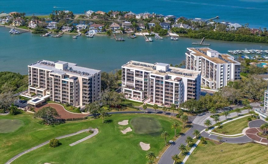 Tucked behind the coveted, guarded gates of Belleair Country Club, this stunning, move-in ready condo in the desirable South Garden community offers an exceptional blend of elegance and effortless coastal living. From the moment you enter, the home is filled with natural light and showcases sweeping golf course views, creating a serene and picturesque backdrop. Thoughtful attention to detail is evident throughout, with coffered ceilings, crown molding, and beautiful flooring enhancing the open and airy floor plan. The heart of the home is a beautifully designed kitchen featuring stainless steel appliances, a breakfast bar, and a custom tile backsplash, all flowing seamlessly into an adjacent dining room complete with custom built-ins and a wine fridge—perfect for entertaining. The kitchen opens to a spacious family room anchored by a sleek linear fireplace, where a wall of sliders leads to a private balcony overlooking lush green fairways. A cozy den provides a peaceful retreat and also offers direct access to the balcony, blending indoor and outdoor living. The primary suite is a tranquil haven, bathed in natural light and highlighted by coffered ceilings, two closets, and a generously appointed ensuite bath. An additional bedroom also enjoys balcony access and shares a beautifully updated hall bath with a walk-in shower. Residents of this sought-after community enjoy a waterfront pool with stunning Intracoastal views, adding to the relaxed, resort-style atmosphere. Ideally located in beautiful Belleair, just moments from fine dining, boutique shopping, and the area’s famous sparkling beaches, this residence offers the perfect balance of luxury, comfort, and location.