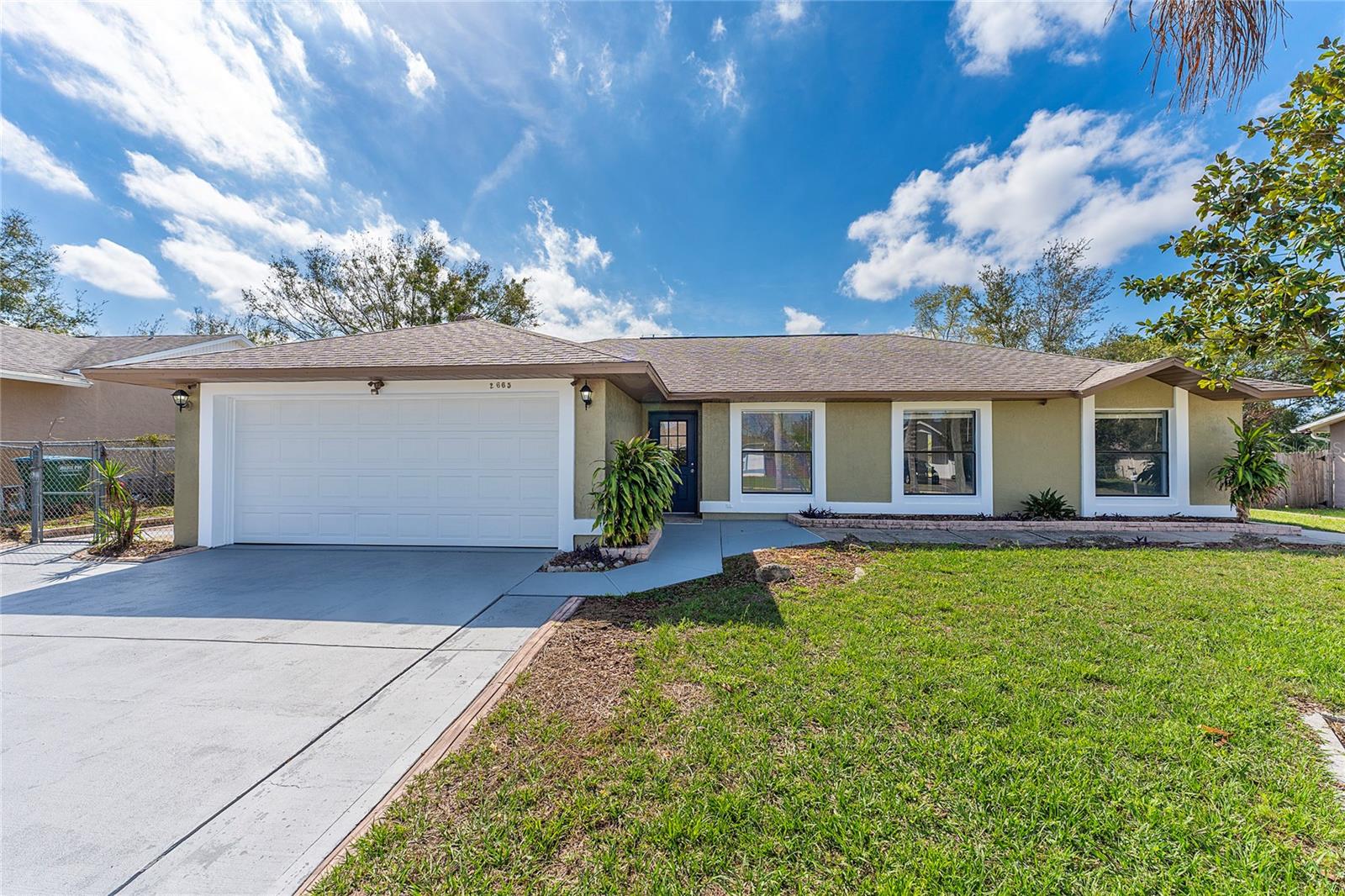 Updated 4BR/2BA home with no HOA in Deltona Lakes! Light, bright, and freshly painted with ceramic tile throughout—no carpet. The remodeled eat-in kitchen features modern cabinetry and backsplash, and opens to a large Florida room/enclosed patio perfect for a home office, play area, or lounge. Enjoy a fenced backyard with storage shed and a 2-car garage with laundry. Centrally located near shoppings, dining, and I-4, gas stations and much more...