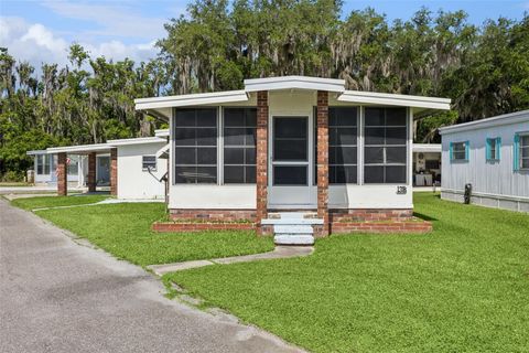 Photo of 13 Cocos Plumosa Drive #B, Eustis, FL 32726 (MLS # O6408783)