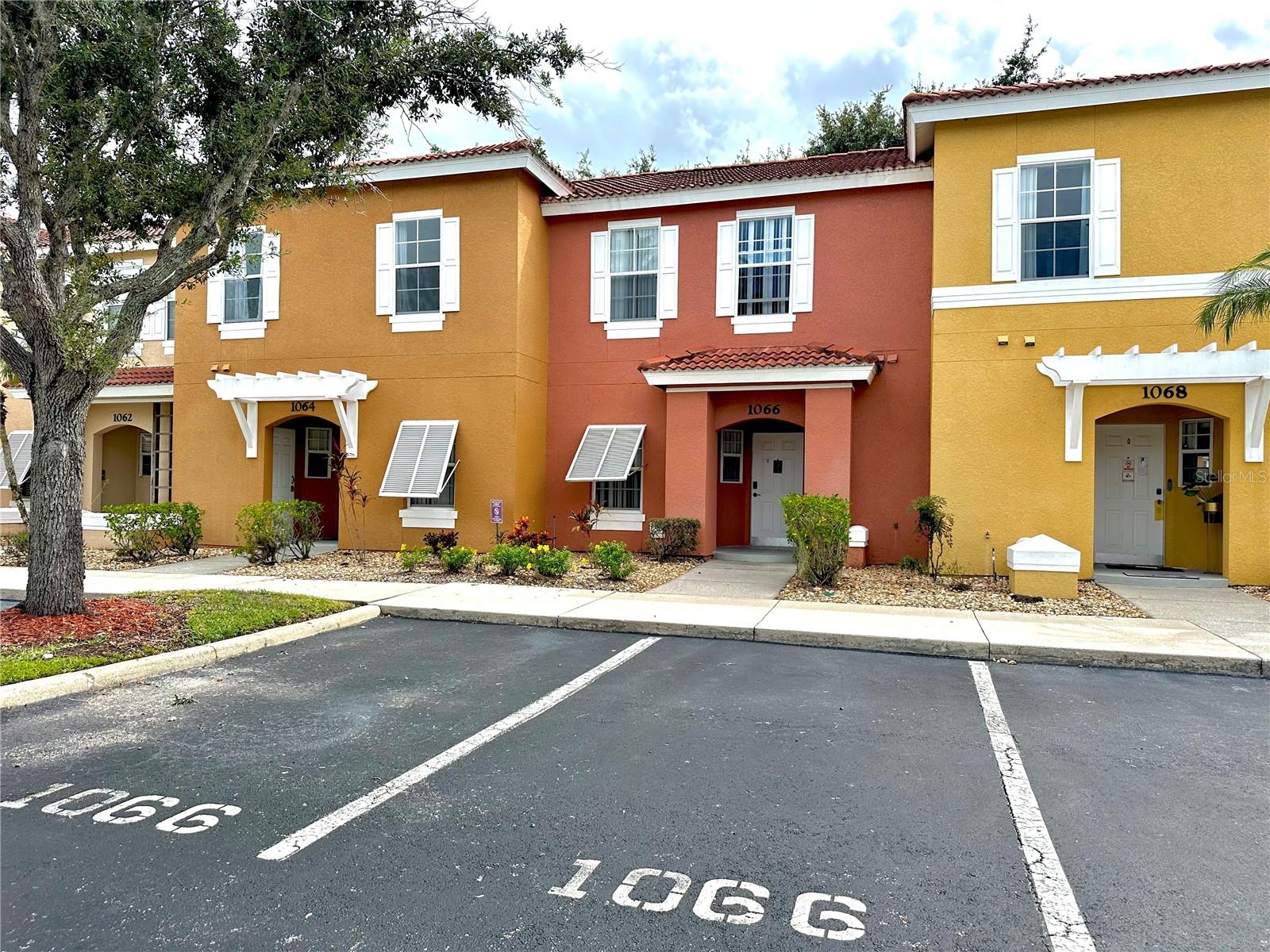 Bright and spacious 3-bedroom, 2.5-bath townhome in the gated Lake Berkley Resort—one of Kissimmee’s most desirable short-term rental communities—perfect for investors or as your own Disney-area retreat. This fully furnished home features an open living and dining area with tile floors, a cheerful, fully equipped kitchen with breakfast bar, and stylishly decorated bedrooms, including a private-balcony owner’s suite and a charming Disney-themed kids’ room. A convenient in-unit laundry room, two full baths plus a main-level half bath, and sliding doors leading to a patio with garden views add comfort and functionality. Lake Berkley Resort offers 24-hour guard security and resort-style amenities: two clubhouses, two community pools with hot tubs, a fitness center, playground, tennis, basketball, and volleyball courts, a lakeside gazebo, walking paths, and stocked fishing lake—providing year-round vacation vibes without leaving home. Ideally located minutes from Walt Disney World, Universal Orlando, SeaWorld, Old Town, US-192 shopping and dining, golf courses, and major highways (I-4 and SR-417), this property delivers outstanding potential for high-return short-term rentals or an enchanting primary residence. Don’t miss this opportunity to own a low-maintenance, income-producing townhome in a thriving vacation destination.