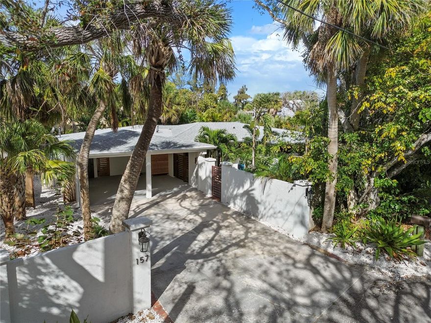 Gorgeous remodel in the heart of Siesta Key and a short walk to Shell Beach access. Located a very large corner lot on a dead end street this home has the space, size, and all the amenities for your perfect getaway. This home has character and charm in all ways. From the banyan and palm trees, to the privacy wall, brick walkway, custom gates,  and lush landscaping surround your Siesta getaway. This home, BIG PASS HIDEAWAY, a very successful vacation rental in previous years has generated over 105-112k consistently at a 73% occupancy rate.  Completely renovated, designer touches, this home is gorgeous. Retro terrazzo floors, Gas fireplace, wood beam ceilings, European designer cabinets, just a few of the touches that bring out the style of this home. 3 main bedrooms and a 4th room connected to the main bedroom to create a double ensuite for the main bedroom that can be used as anything you wish. Currently set up as 4th bedroom with separate access to the pool area, it could easily be a studio, workout room, a nursery, a reading lounge. It's a special feature. As far as the improvements, everything has been completely redone. All new AC's main and mini split, new duct work. All repainted, new kitchen cabinets, new appliances, bathrooms renovated with designer tile. All new wiring, house was replumbed with new stacks and lining in main drain. ALL NEW HURRICANE IMPACT DOORS AND WINDOWS. New Pebble tech pool finish. Roof is 6 years old. New irrigation pump. Low voltage lighting. Tons of outdoor spaces from the oversized pool, to the garden and grilling areas. Hangout on the screened in patio or enjoy the firepit area. Lose track of time on your Florida visits and drift down the street to Siesta Key village and enjoy all it has to offer from shops, to dining, to the best beach USA!
This home is gorgeous and priced to sell. Generate income. The choice is yours. Absolutely nothing to do but move and enjoy the siesta key life. Live in it. Schedule your private showing today. ***Can be purchased turnkey fully furnished on a separate bill of sale.***