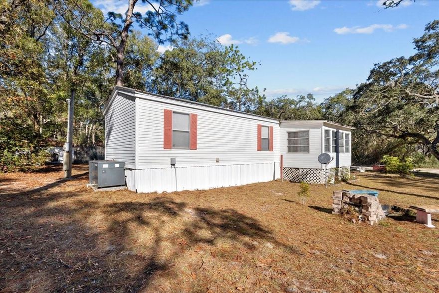 Perfect MOVE IN READY home located in Dixie County a bike ride to Hinton Landing (a public boat ramp) at the Suwannee River. Make this the perfect forever home, seasonal home OR short term rental. Location is ideal with literal minutes to freshwater and the Gulf of Mexico yet a short drive to town for all dining and shopping amenities. A perfect 2 bedroom/1 bathroom located on FOUR lots coming in at .45 acres. This property has two wells on it and is the best size for all your storage needs including camper or RV. Home is in great condition with metal roof approximately 2 years old, New AC approx 3 years old and septic recently pumped. Immaculate condition inside with a nice split floor plan. Covered porch perfect for enjoying the morning coffee or tea AND an enclosed porch perfect to lounge and relax during this hot Florida summers. Accepting cash , conventional and VA loans, call today for YOUR tour!