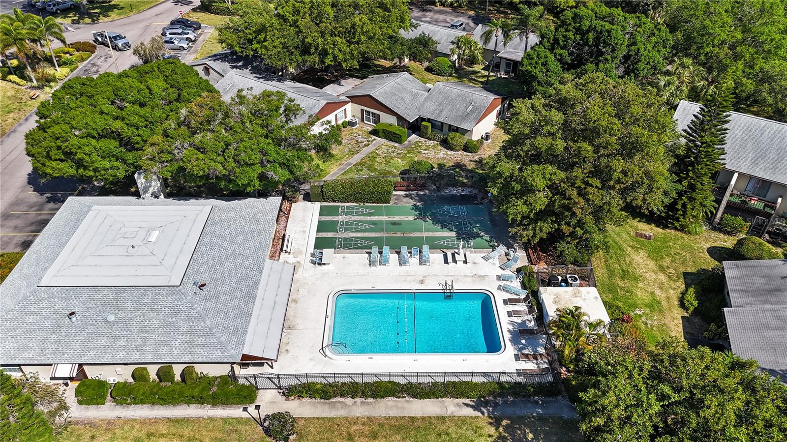 Location, location, location! Just 10 minutes to St. Pete–Clearwater Airport and 20 minutes to Indian Rocks Beach, this renovated second-floor end unit in Woodside Village offers top tier benefits! *NO FOOTSTEPS above, and the comfort of being high & dry! MOVE IN READY renovated END UNIT condominium. Updates include a 2025 shower & bath renovation, 2024 roof, and new 2024 electrical panel. The kitchen features white shaker cabinets, granite counters, subway tile backsplash, stainless steel appliances and a wine refrigerator, with fresh paint and vinyl plank flooring throughout. The bedroom has a mirrored closet with organizer, and the bathroom is en-suite. Enjoy peace of mind with masonry construction, no milestone inspection required, and a deeded parking space right out front. Relax on your covered balcony or head to one of three sparkling pools, the clubhouse, picnic area, or car wash. Ready to roam a little further? It’s just a short drive to Disney, Busch Gardens and International Drive. World class fishing, golf and your choice of water sports are at your fingertips. Conveniently located to major league sports - football, hockey, baseball, soccer. Spring training camps for multiple MLB teams are nearby. Whether you are full-time or part-time, this is a great way to own your future at a rarely seen price point. All-ages, pet-free community with full-time onsite management and security. Rentals allowed after one year. Move-in ready, carefree living close to beaches, dining, shopping, and adventure!