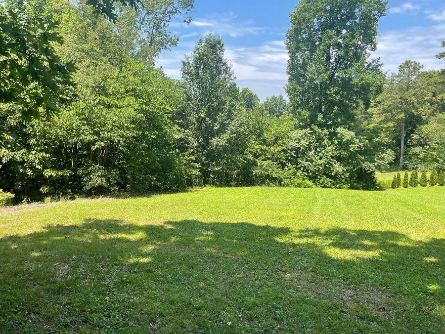 Great homesite located on cul-de-sac in lakefront community bordering the Little Tennessee River. Two lots were combined to create approximately .75 acre lot. Pictures show one side is cleared and the other wooded. The community has neighborhood events, activities and clubhouse with dock.