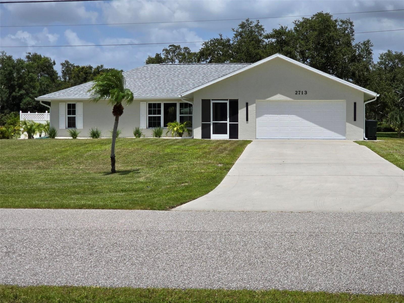 Welcome to Venice Acres! Since you are viewing this listing, you may be waiting for the right home to come up in this unique community. A community that offers acreage and space between properties, large beautiful oak trees, but yet still in town. This one has it all! A 3/2 block home, with a 2 car attached garage, and a block 40x20, "4 car Detached Garage". Resurfaced pool w/screen enclosure, covered patio and outdoor deck fenced for privacy. This is a home that doesn't need remodeling or updating because it's already been completed. This one is ready to move into, and "Priced Right"! New roofs on house and detached shop, impact slders, porcelin tile throughout, new fans, lighting, outlets, countertops, appliances, bathrooms, water filtration system, AC serviced and ducts cleaned, pool cage repainted and rescreened, new pool pump and pool light, and more. Open spacious kitchen with generous amount of cabinets, bright lighting, fireplace in the family room and sliders opening to the pool area. The dedicated laundry room is located off the kitchen with access to the garage. Located on a corner lot that also has access into the backyard and the detached shop off Lambeth Circle. Mature oak trees provide shade for multiple areas of the property, leaving options for maybe a picnic table or a swing under their beauty. Take a moment to drive the neighborhood, to admire many beautiful properties in Venice Acres as most residents do take pride in their homes. You'll know if it's right for you, so grab your calendar and phone to schedule a showing and see for yourself. This community offers a great place for residents to walk, jog, bicycle, and you'll may even see a golf cart, so please observe the speed limit and remember that children may be at play. Thanks for looking.