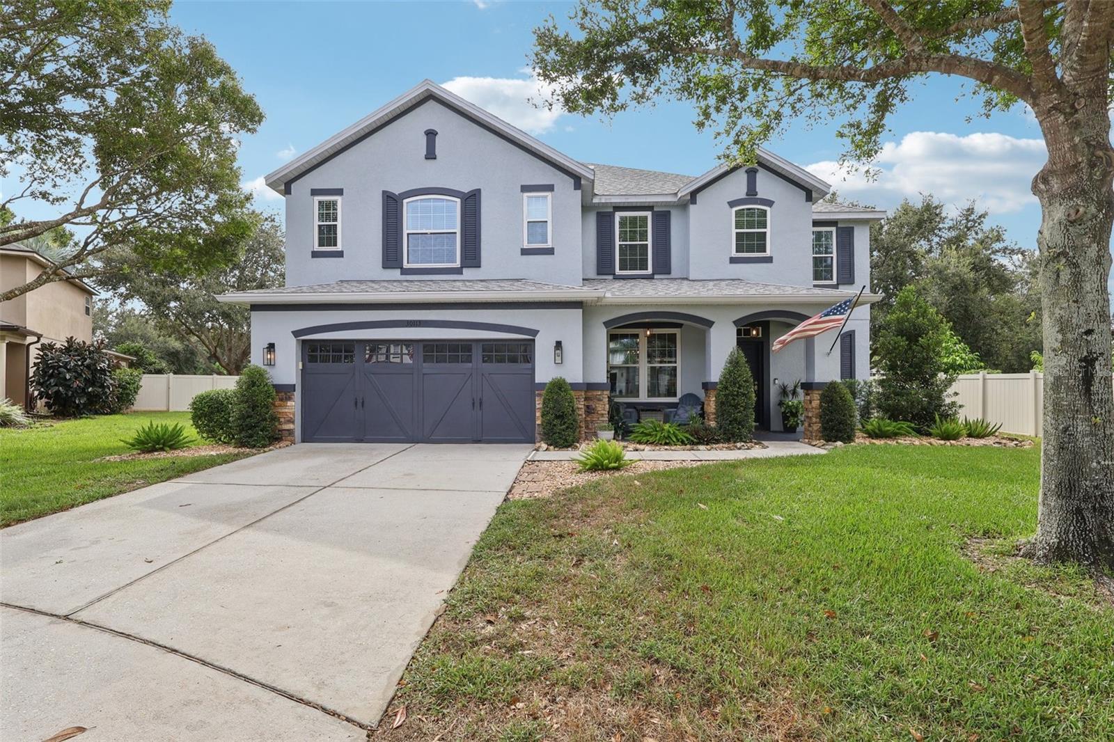 Welcome to this stunning 4–5 bedroom, 3.5 bath home in the highly sought-after gated community of Sullivan Ranch in Mount Dora. With an elegant blend of open concept living and defined spaces, this home is designed for both comfortable everyday living and stylish entertaining.
As you enter, the beautiful staircase becomes a focal point between the formal sitting room and the spacious family room, where a cozy gas fireplace creates the perfect gathering spot. The chef’s kitchen is a true highlight, featuring double ovens, fingerprint-resistant black stainless-steel appliances, a prep island with sink, breakfast bar, and abundant cabinetry. The convenient design places the garage entry, laundry room, and half bath just steps away.
Enjoy seamless indoor-outdoor living with views of the sparkling pool and waterfall from the family room and kitchen. The screen-enclosed lanai is perfect for entertaining, offering a bar with storage, a refrigerator, and plenty of room for family and friends to relax and unwind.
Upstairs, the expansive primary suite is a retreat tucked privately at the end of the hallway, complete with an oversized layout and spa-like bath. Two bedrooms share a hall bath, while another bedroom features an ensuite Jack-and-Jill bath connected to the versatile bonus room, ideal as a 5th bedroom, media room, or office.
Notable updates include a new roof, double-paned lifetime warranty windows, exterior paint (2022), and all-new kitchen appliances (2024). Every bath is appointed with Moen For Life faucets. Outside, enjoy lush landscaping, gardening space, and a street lined with stately magnolia trees.
Sullivan Ranch offers resort-style amenities including a pool, clubhouse, fitness center, playground, splash pad, dog park, and walking trails. Located less than 2 miles from the 429 interchange, you’ll have quick access to Orlando and all of Central Florida, while being just minutes from downtown Mount Dora, known for its lakeside charm, boutique shops, dining, and festivals.
This home truly has it all—style, updates, amenities, and location. Don’t miss your opportunity to make it yours!