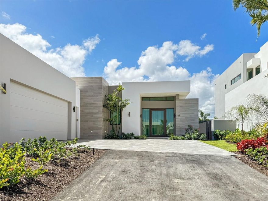 Welcome to your dream home in the exclusive Isles community! This stunning property offers luxury living with modern design and timeless elegance. Fully furnished with 4 bedrooms, 4 bathrooms, and 2 half bathrooms, spanning approximately 3,857 square feet, it's designed for comfort and style. The interiors boast sleek lines, high-end materials, and state-of-the-art fixtures, creating an atmosphere of sophistication and comfort. Enjoy the pool and jacuzzi with a heater and salt system, along with a half bathroom, and a kitchen equipped for gas if desired. Plus, practical amenities include a maid room, covered parking, BBQ area, electric retractable curtains, ceiling fans, a 450-gallon cistern, water softener, and upgraded gardens. Embellished with over $400k in high-end décor and furnishings included with the sale, this home exceeds expectations for refined living. The HOA fee, encompassing front lawn maintenance and garbage collection, amounts to $1,250. Additionally, the property includes a fully-equipped power generator capable of supplying electricity to the entire home.