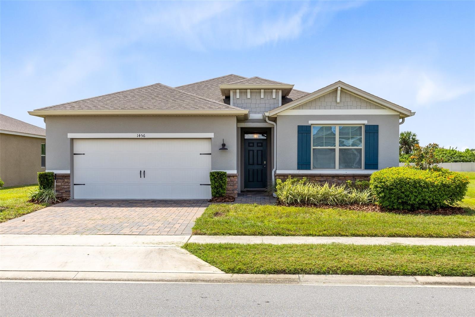 Welcome to 1456 Hopedale Place, where the seller is offering to pay 1% of the purchase price towards buyers’ closing costs. This stunning 4-bedroom, 2-bathroom home located in the highly sought-after gated community of Rosecrest in Seminole County is a move-in ready home offering an open-concept floor plan centered around a beautifully designed kitchen featuring quartz countertops, upgraded 42” upper cabinets with crown molding, under-cabinet and upper lighting, and stainless-steel appliances. The kitchen flows seamlessly into the spacious family room and dining area, with sliding glass doors that open to a covered porch overlooking a serene pond—providing tranquil views both inside and out. The versatile three-way split floor plan is ideal for a variety of living arrangements, offering both functionality and privacy. Rosecrest is a gated community that features a resort-style pool with shaded cabanas, and lawn maintenance is included—offering ease and comfort for homeowners. Just a short drive away, you'll find the charming historic district of Sanford, home to one of the area’s largest lakes, a scenic 5-mile boardwalk, a marina, and waterfront dining at upscale restaurants. Downtown Sanford also boasts a lively farmers market, unique boutique shops, art studios, and a performing arts theater.