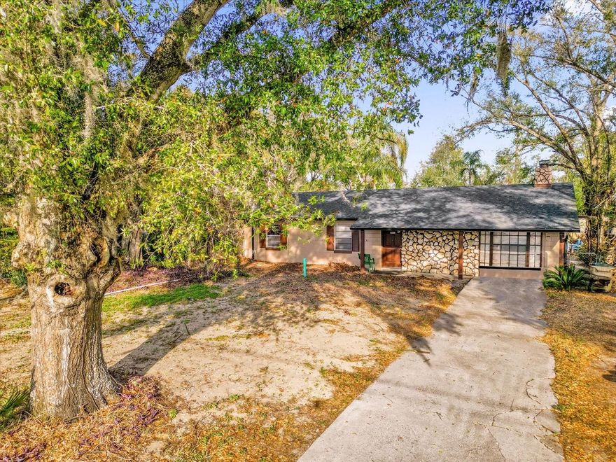 Rare opportunity to own nearly one acre of fully usable land with no HOA, offering exceptional flexibility for homesteading, hobbies, business use, or future investment. This 3-bedroom, 1-bath home with 1,432 square feet combines comfortable living space with outdoor features rarely found in today’s market.

Inside, the home features tile and laminate flooring, central A/C, and a cozy wood-burning fireplace that anchors the main living area. Major improvements include a 2024 roof, newly installed drain field, two septic tanks, and the added peace of mind of a whole-home generator, ensuring reliability and comfort year-round.

The outdoor space truly sets this property apart. The nearly one-acre parcel is fully usable and farm-friendly, ideal for gardening, animals, or small-scale agriculture. The property includes two storage sheds, a dedicated workspace structure, and a covered back porch perfect for relaxing or entertaining. A hot tub is also included, creating a private outdoor retreat.

For buyers needing additional flexibility, the property features an RV hookup already in place. While the RV does not convey, the infrastructure is ready for immediate use.

Conveniently located in growing Sorrento with easy access to Mount Dora, Eustis, and major Central Florida roadways, this property offers the rare combination of space, freedom, infrastructure, and long-term potential that is increasingly difficult to find.