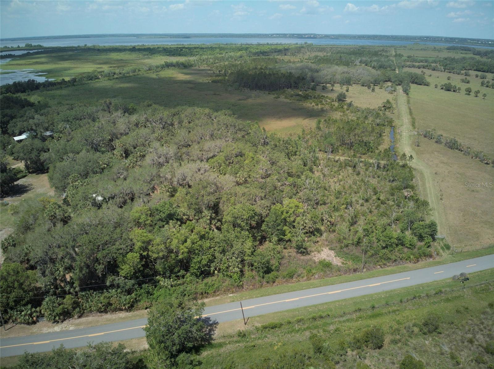 Embrace the opportunity to own 3 acres of picturesque Florida land in the tranquil countryside of Leesburg. Located on Emeralda Island Rd, this high-and-dry parcel offers endless potential with its peaceful natural surroundings and paved road frontage. The property features a mix of open space and mature trees, ideal for building your dream estate, a hobby farm, or a secluded getaway. With plenty of room for privacy and freedom, you’ll enjoy daily wildlife sightings and serene sunsets. Conveniently located just minutes from downtown Leesburg, Lake Griffin, and major highways, this is a rare opportunity to create your own personal retreat while staying close to shopping, dining, and recreational amenities. Don’t miss your chance to secure this slice of Florida paradise!