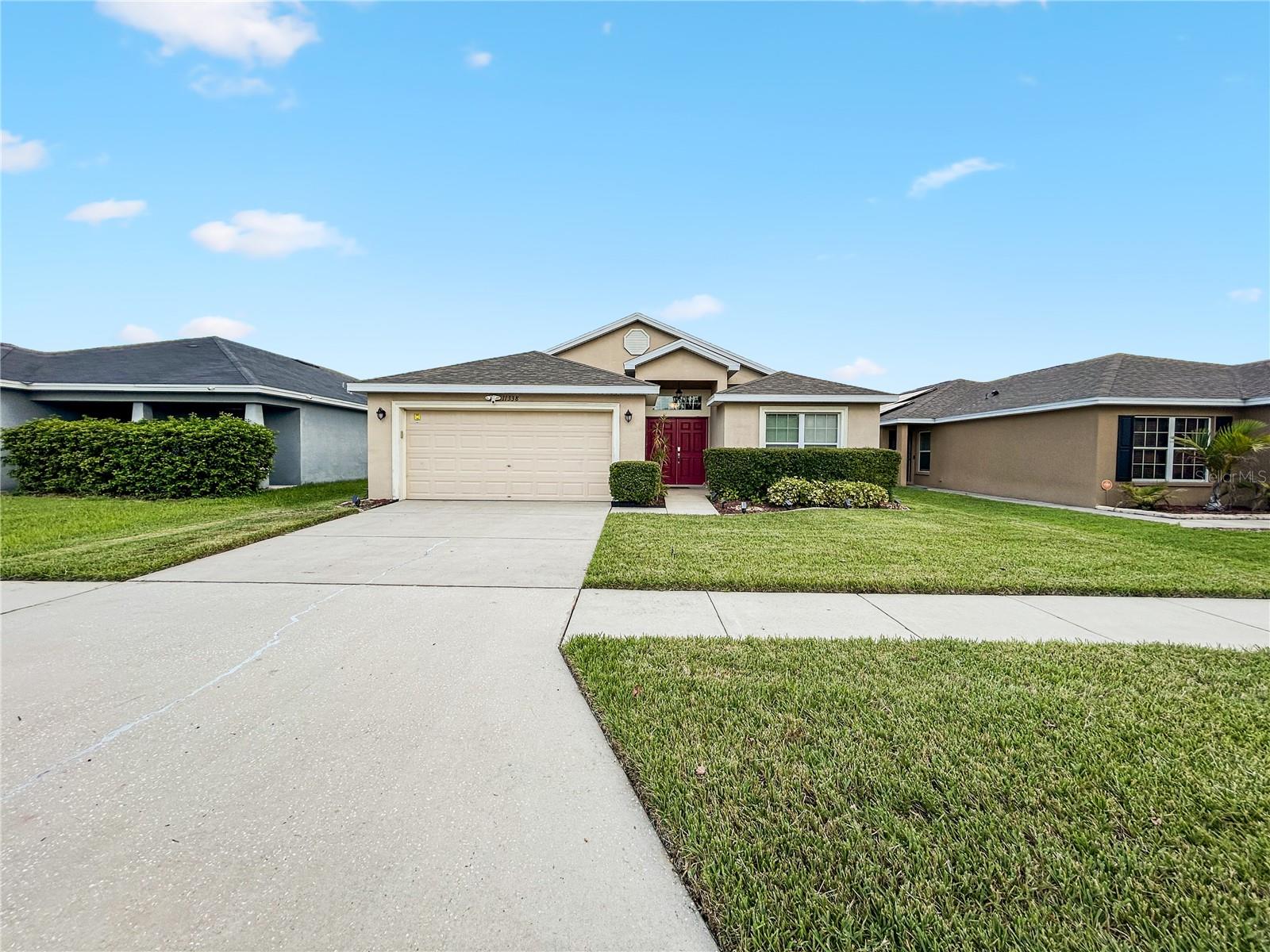 Welcome to 11338 Southwind Lake Dr., Gibsonton, FL 33534 — A Move-In Ready, Smart Home Oasis with Water Views
Discover a rare blend of modern elegance, security, and serenity in this beautifully maintained 3-bedroom, 2-bath, 2-car garage home—perfectly positioned on an oversized lot with no backyard neighbors, offering privacy, peace of mind, and tranquil water views.
From the moment you arrive, the manicured St. Augustine lawn and upgraded landscaping set the tone. Step through French double doors with a smart lock into a wide foyer, where polished real hardwood floors, vaulted ceilings, and an open split-bedroom layout create a welcoming atmosphere.
The chef-inspired kitchen is a centerpiece, complete with granite countertops, custom tile backsplash, real wood cabinetry, stainless steel LG appliances, a brand-new Insinkerator disposal, and a large kitchen window for natural light. A separate laundry room with a washer and dryer on storage pedestals adds functionality.
The primary suite is a true retreat, featuring sliding glass doors to the lanai, a deep jacuzzi-style soaking tub, tiled walk-in shower with glass enclosure and waterfall sprayer, dual sinks, linen closet, and a spacious walk-in closet. Two additional bedrooms at the front of the home share a full bath, also upgraded with waterfall shower fixtures.
Step outside to enjoy the Florida lifestyle:
• Screened & tiled lanai with direct access from the master and dining area
• Fully fenced oversized backyard with 3 gates, including a double gate with water access—perfect for fishing, kayaking, or entertaining
• 10’ x 8’ shed with tools and equipment available with full-price offer
• Custom curbing and irrigation system with programmable Rainbird controls
This home is equipped with premium smart-home features for security and convenience:
• Ring doorbell with two-way talk, front and rear cameras, and floodlights
• Smart thermostat, smart lock, and MyQ garage opener (remote access from anywhere)
• Motion-activated exterior lighting and auto-entry lighting
Notable upgrades include:
• Brand-new 20-year roof (2025) with upgraded 4-tap shingles
• 7-stage Aqua Soft whole-house water filtration system (installed in garage, not exposed outdoors)
• Epoxy-coated garage floor for easy maintenance
Low-cost living is another advantage with a low HOA of $50/month, NO CDD fees, low taxes, and no flood insurance required.
Ideally located just minutes from Tampa, major highways, Publix, Walmart, schools, parks, and the brand-new Advent Health Hospital (8 minutes away), plus a private walking trail around the neighborhood pond.
This property offers the rare combination of affordability, luxury, security, and waterfront tranquility. Don’t miss your chance—schedule your private showing today and make 11338 Southwind Lake Dr. your new home.