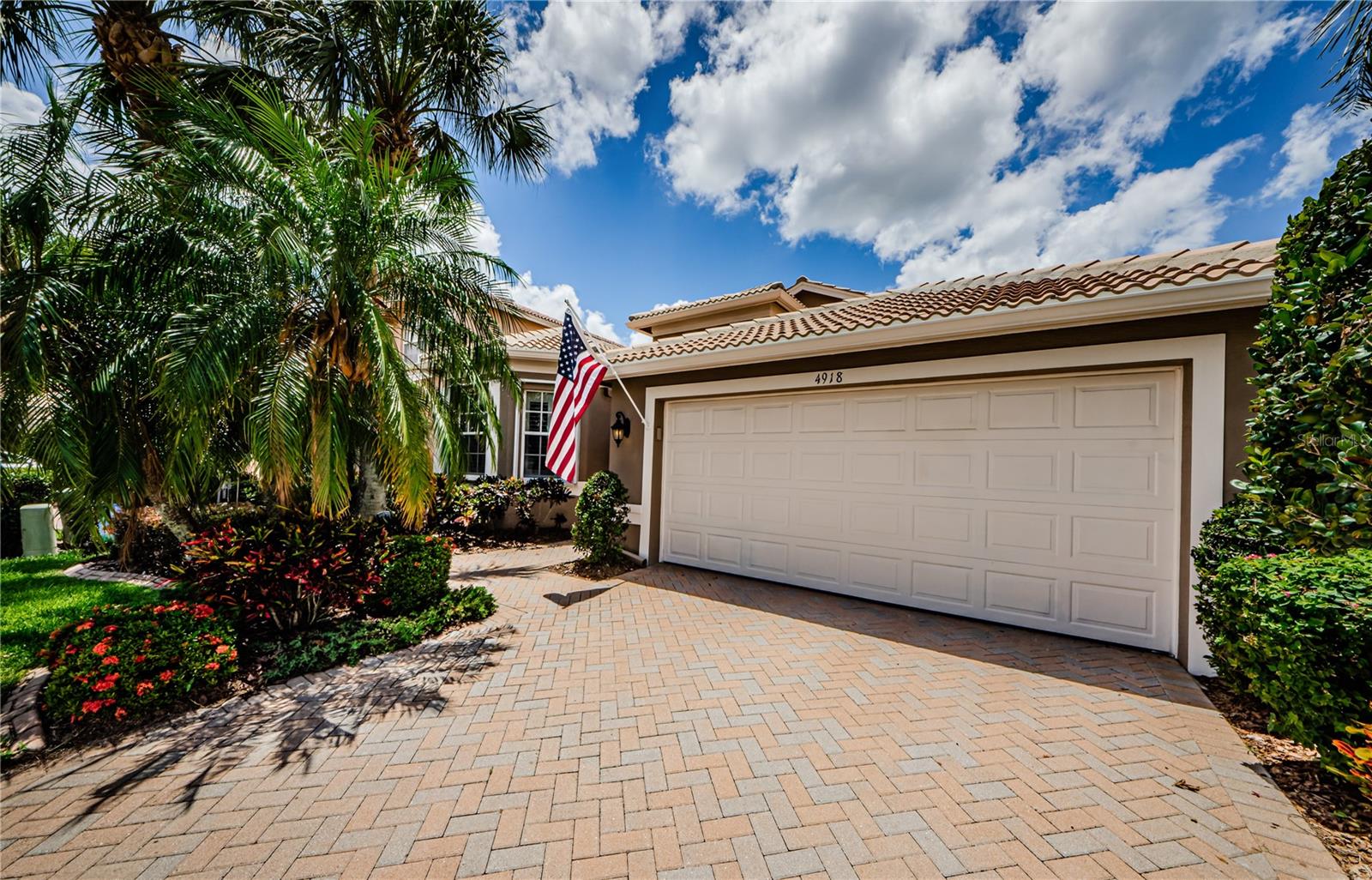 Welcome to 4918 Sandy Brook Circle ~ Nestled within the charming community of Valencia Lakes, this charming Roma floorplan built by GL Homes offers a harmonious blend of elegance and functionality. Providing 3 bedrooms plus a dedicated office this spacious layout seamlessly integrates family and formal living with a well placed open floor plan. The kitchen is a true culinary haven, featuring granite countertops, ample cabinetry and tile flooring that effortlessly complement the chefs' dream appliances. The primary bedroom exudes sophistication with its elegant ceiling design and hardwood flooring, providing a serene and rejuvenating space. The primary bathroom offers ample vanity space and elegant lighting, creating a spa-like atmosphere. Throughout the home, meticulous attention to detail is evident, from the crown molding to the high-end finish work. The property's lush landscaping and vibrant curb appeal set the stage for the expansive covered patio, which overlooks the serene pond, offering a tranquil outdoor living experience. The home's versatile layout includes a dedicated office, a craft room or 3rd bedroom and a two-car garage, providing plenty room for various lifestyle needs. The community of Valencia Lakes, a 55+ resort-style development, offers its residents access to an array of resort-inspired amenities, ensuring a truly exceptional living experience!