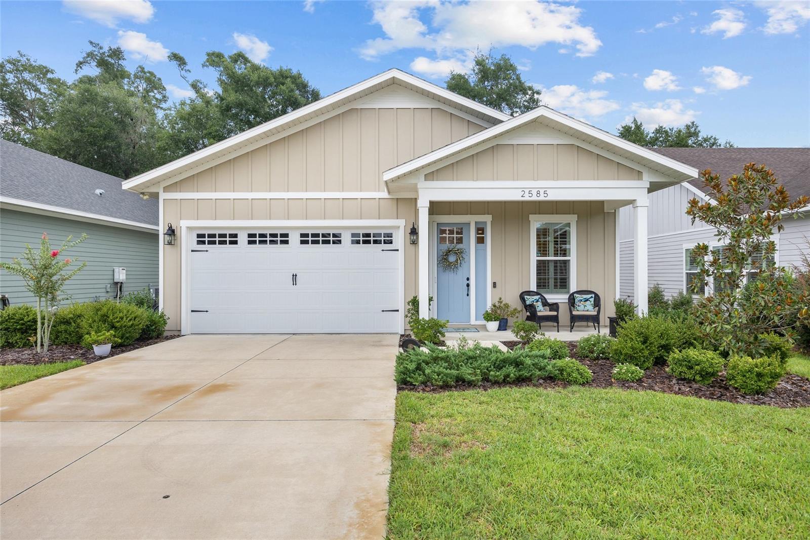 Welcome home to this immaculate, custom-built Craftsman-style residence, ideally located in the heart of NW Gainesville. This turn-key home has been meticulously maintained, and pride of ownership is evident throughout. The inviting front porch is the perfect spot to relax and unwind. Step inside to an open-concept floor plan featuring luxury vinyl plank flooring in the living areas and bedrooms, with tile in the bathrooms and laundry room. Elegant design details include plantation shutters, tray ceilings, decorative trim, and crown molding. The kitchen steals the spotlight with its generous island with seating, white shaker cabinetry, quartz countertops, stainless steel appliances, gas range, built-in microwave, charming brick backsplash, under-cabinet lighting, built-in coffee station, and large pantry. The primary suite offers a serene retreat with a generous walk-in closet and an ensuite bathroom featuring dual vanities, a built-in linen cabinet, walk-in shower, and a private water closet. The spacious laundry room offers ample cabinetry and a sleek stainless steel utility sink for added functionality. Step outside to the screened-in patio, equipped with a ceiling fan and overlooking the fully fenced backyard. Just beyond, there is a paver patio with seating area that offers an inviting space for outdoor entertaining. Additional highlights include a tankless water heater, irrigation system, cellulose insulation, low-maintenance hard board siding, and underground utilities. This exceptional home is just minutes from UF, NFRMC, Santa Fe College, and a variety of shops and restaurants!