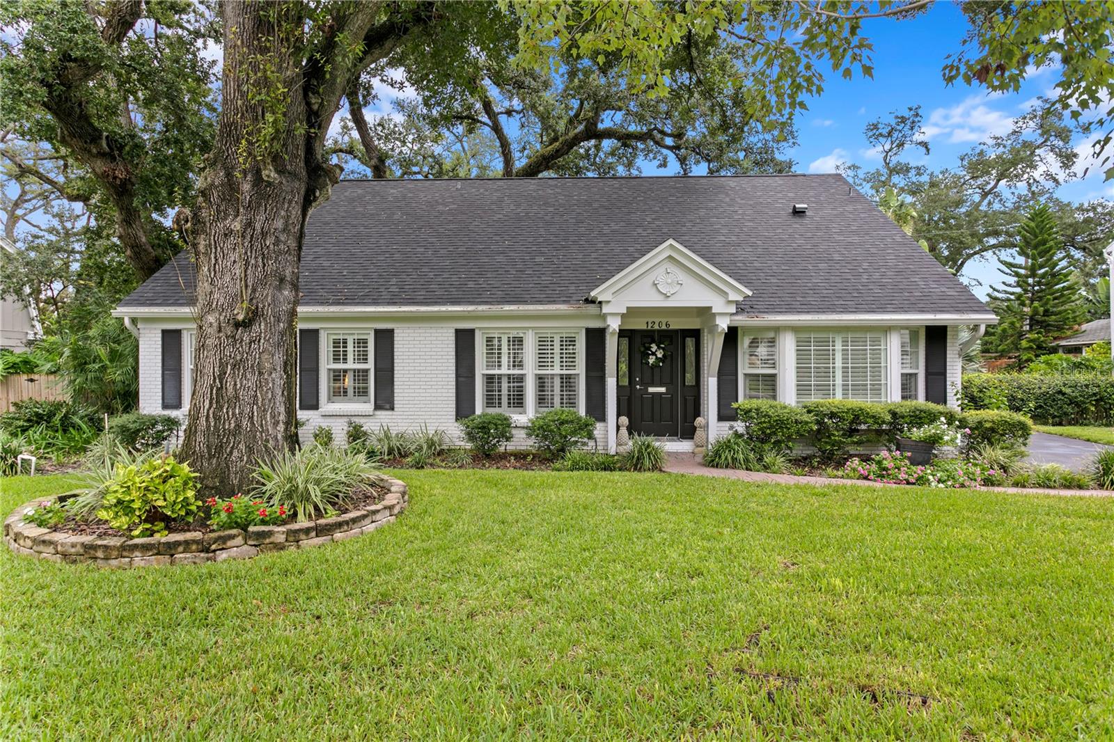 This 5 bedroom, 3 bathroom home is situated on a large, picturesque lot in sought-after Culbreath Bayou. The home blends the classic Cape Cod charm with beautiful, modern renovations throughout. The entry leads into the large formal living room with views of the patio and backyard. The dining room has a bay window and is open to the newly-renovated kitchen with quartz counters, an island, all new appliances including a wine fridge, and two sinks. The family room has a cozy fireplace and French doors that lead to a covered, screened lanai with tongue and groove ceiling – perfect for indoor/outdoor living and entertaining! The first floor primary bedroom suite has a double closet with built-in shelving and newly remodeled bathroom with double vanity and tiled shower. Two additional bedrooms on the first floor share a full bathroom with a claw foot tub. Upstairs, two spacious bedrooms have ample closet space and share another full bathroom. Attic eave access offers additional storage space. A breezeway from the main home serves as a mudroom/laundry room and butler’s pantry, with ample cabinet space for storage. The fully fenced, and large backyard is serene and private. Other features of this home include engineered wood flooring, plantation shutters, crown molding, newer windows and roof.