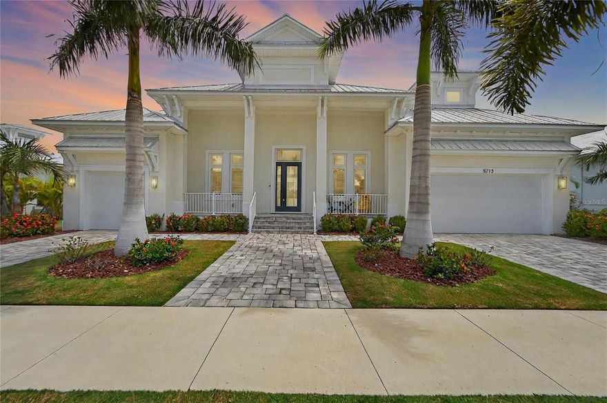 Under contract-accepting backup offers. Welcome to 5713 Tybee Island Drive, a stunning newer construction home with a brand-new private dock with 13k boat lift and direct saltwater access to Tampa Bay, located in the highly desirable gated community of Mira Bay. This exceptional property features four bedrooms, three and a half bathrooms, and a dock with lift ready for your boating adventures!Move with confidence into this better-than-new custom home. Designed with both functionality and luxury in mind, the home offers high-end stainless steel appliances, including a natural gas industrial oven, shaker cabinets that extend nearly to the ceiling, and a navy-blue island that provides abundant prep space and seating. Custom lighting accents the kitchen and dining areas. The open-concept layout includes 10-foot sliding glass storm-rated doors leading to an expansive lanai overlooking a beautiful pool and hot tub. Imported tile flooring adds elegance to the main living spaces, while the flexible formal dining or seating area provides versatility. The fourth bedroom features a loft, balcony views, a full bathroom, and a wine bar. The primary suite offers dual closets, split sinks, a soaking tub, and a custom walk-through shower. Two guest bedrooms are located on the main floor, separated by a full bathroom, with the large laundry room conveniently nearby. Additional features include built-in coat and shoe cubbies and a split three-car garage with a dedicated golf cart bay and driveway. The home also boasts hurricane-rated windows and doors, a durable metal roof, tankless water heater, central vacuum system, LED lighting, crown moldings, and tray ceilings for added detail. Outdoor living is enhanced by gas and electric connections for a custom outdoor kitchen and a custom dog run with a self-access door. Situated in Mira Bay, one of Apollo Beach’s most sought-after communities, residents enjoy access to amenities including a 24-hour fitness center, café, resort-style pool, and sports bar. This is a golf cart friendly community