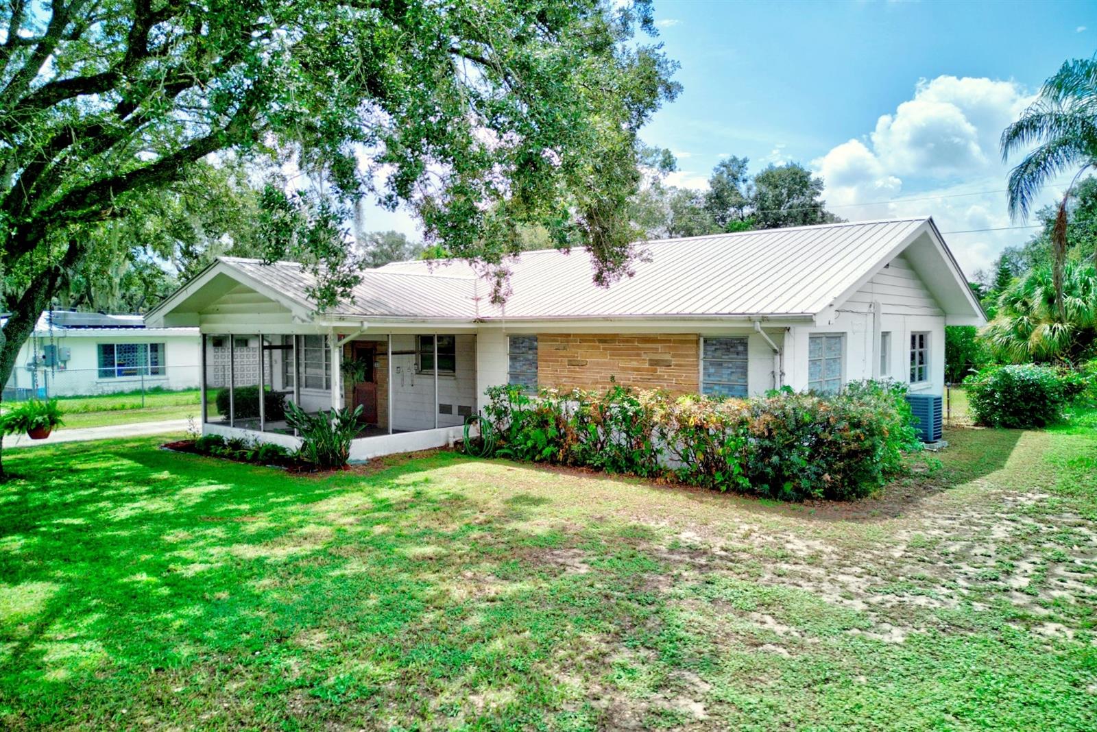 Charming 3 bedroom, 2 bath home with bonus room and dedicated office, perfectly located in the heart of downtown Avon Park. Built in 1959, this home blends classic character with modern upgrades. Features include a durable metal roof, insta-hot water heater, and spacious back porch ideal for relaxing or entertaining. The property is fully fenced and comes with two storage sheds, offering plenty of space for tools and equipment. With its versatile floor plan, extra rooms, and prime location near shops, dining, and local amenities, this home is a must-see for anyone seeking comfort and convenience in a vibrant community.