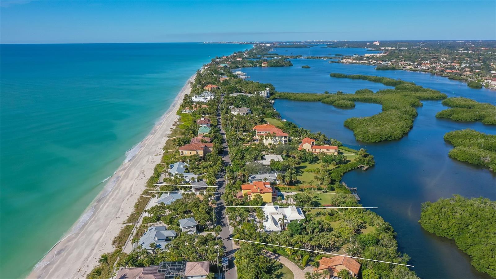 Closed sale price of $2M reflects the property's "illegal non-conforming" zoning status which was discovered by title search during a pending sale in June 2023. The seller had purchased the home on the 9/10 acre lot in 1983 when the neighbor to the north, who had 2 homes on approx. a 1.5 acre parcel, spun off this property...not realizing, in 1975, Sarasota County had down-zoned Casey Key to 1-acre minimum lot requirements. The seller hired an attorney but, ultimately, the Zoning Board refused to grant an exception or variance and declared if the home was destroyed (voluntarily or involuntarily) it could not be rebuilt. The lot would have to remain vacant! Also the current home could not be expanded and even a pool could not be built. The first buyers cancelled their contract. The party who eventually purchased the property was aware of all this and the sale closed almost a year from the original listing date.
The deeded beach access across the street lies about 100 ft. to the north and leads to long stretches of beautiful sandy shorelines in both directions. Enjoy a beach and boating lifestyle, not far from shopping and dining, only about 20 minutes from Venice and 30 minutes into Sarasota. Casey Key offers a quiet solitude that has long been home to a host of the rich and famous. The narrow winding main road passes bungalows and mansions. Escape the hustle and bustle of the islands to the north while having the accessibility of the renowned arts and culture and acclaimed medical facilities nearby.
Non-conforming use due to lot being less than one acre limits what may be done with the property. The dock and patio decks are not warranted by seller. The irrigation system is not operational.