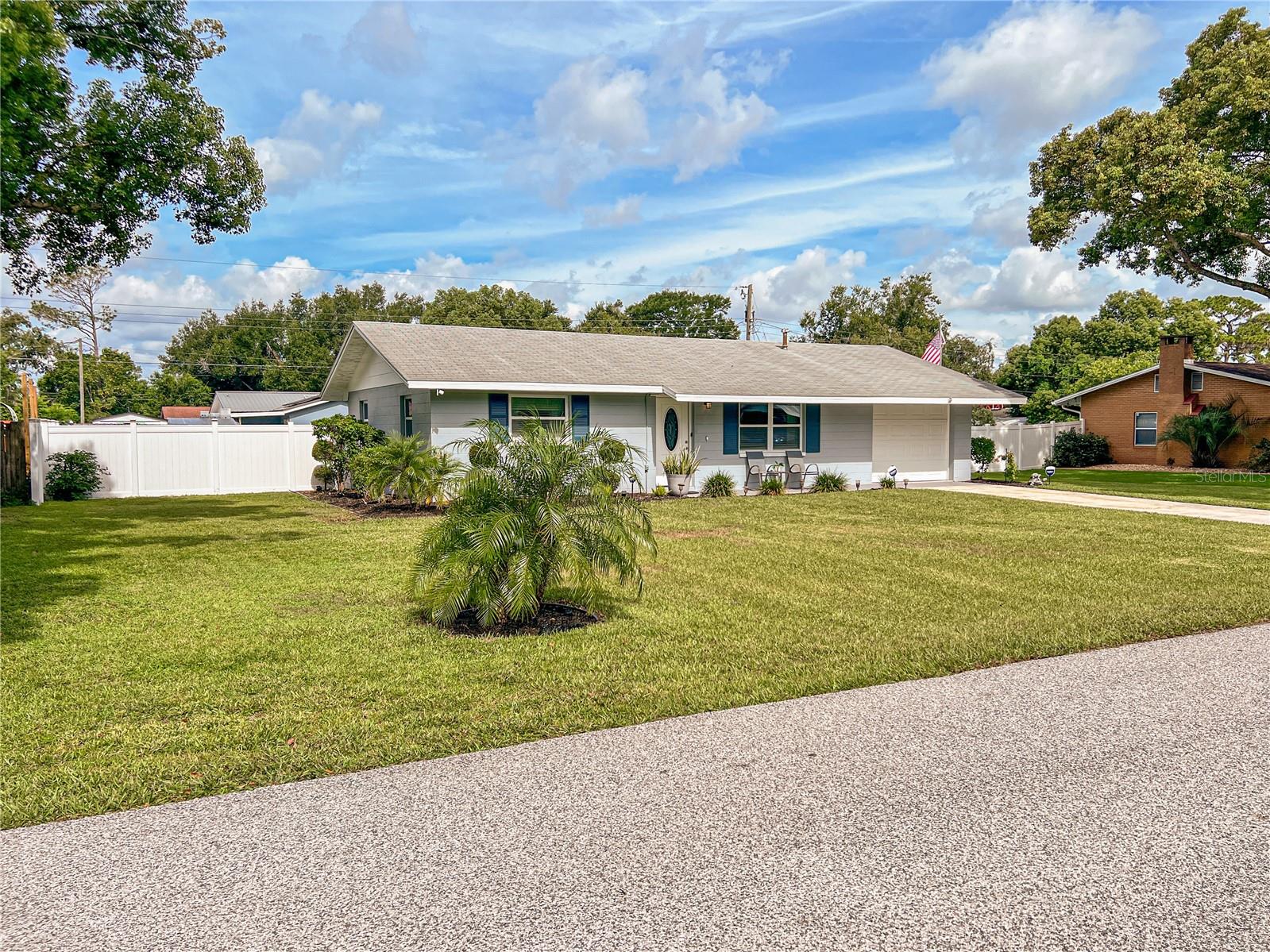 Affordable comfort meets classic Florida living in Zephyrhills! This move-in-ready gem is perfect for first-time buyers, snowbirds, or anyone looking to downsize without sacrificing charm or location. Thoughtful renovations in 2022 and 2023 introduced stylish, flowing tile floors (2022) throughout the entire home and a more open, functional floor plan. </p><br > A large picture window and oval glass insert in the front door fill the spacious living room with natural light, highlighting wood-look tile flooring and a modern ceiling fan. The 2023 kitchen and dining room makeover features crisp shaker-style cabinetry with contemporary hardware, granite countertops, sleek stainless steel appliances, and updated plumbing and lighting fixtures. The concrete block Florida room was insulated in 2022, transforming it into a true all-seasons space. With windows on three sides and a glass-panel exterior door, this room is bathed in natural light by day and enhanced by recessed lighting at night. Each of the two spacious bedrooms offers windows on two walls for abundant natural light, along with ceiling fans to keep things cool and comfortable. The front bedroom is especially generous in size and features custom paint colors and ample closet space. The updated (2023?) bathroom includes a new vanity, modern mirror, and upgraded plumbing and lighting fixtures. A built-in linen closet adds convenience and extra storage. </p><br > The garage has been thoughtfully converted into two separate spaces, but could easily be restored to a traditional one-car garage if desired. One side is currently used as an office or den — perfect for a media room, homeschool setup, guest space, or even a quiet retreat. The other side functions as parking for toys and storage for lawn equipment but would also make an excellent workshop or hobby space. </p><br > Enjoy peaceful mornings on the front porch, overlooking a generously sized and beautifully landscaped front yard. Out back, a private retreat awaits - fully enclosed with newer (2022) vinyl fencing. Multiple seating areas create the perfect setting for outdoor entertaining, while offering space for four-legged companions to roam freely. </p><br > Situated on nearly a quarter-acre, this charming Zephyrhills home combines space, comfort, and location. Just minutes away, you'll find Hercules Park, Zephyr Park with its popular Waterplay splash pad, the Zephyrhills Library, Krusen Skate Park, and a variety of other recreational amenities. Schools, shopping, a theater, a bowling alley, and dining options are all conveniently nearby - making this home as practical as it is appealing. The home has weathered recent storms with no reported flood or wind damage - offering peace of mind along with comfort. Plus, with no HOA or CDD fees, you'll enjoy the freedom and affordability that come with true homeownership. Whether you’re starting out, settling down, or looking for a low-maintenance Florida home, this one checks all the boxes. Let’s get you through the door. Schedule your private showing today!
