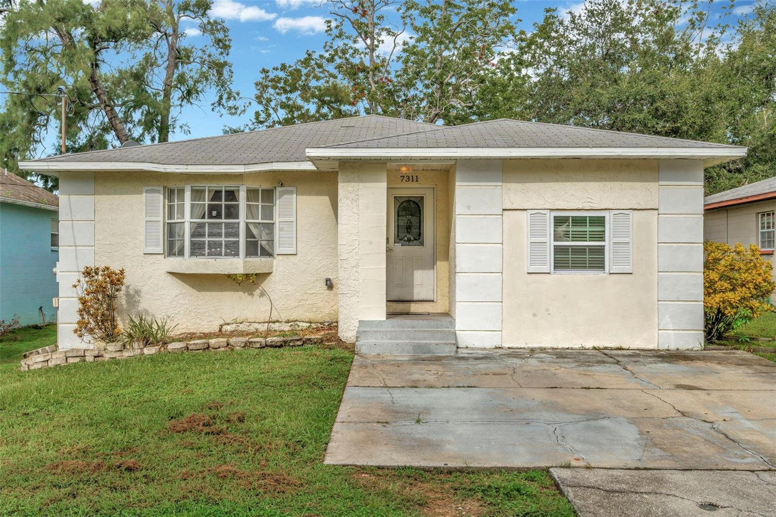 Welcome to 7311 S Sherrill St, located in the heart of beautiful Port Tampa! This charming home radiates comfort and character, offering the perfect setting for family living. Built to withstand the elements, the home’s elevated design ensured that even during the most recent hurricanes, not a single drop of water entered the interior.
Inside, you’ll find a warm and inviting space full of charm, ready to be personalized to your taste. While the home may need a little TLC, it’s a fantastic opportunity to create your dream family haven in one of Tampa’s most desirable neighborhoods. Don’t miss your chance to own a piece of Port Tampa and enjoy all of its beauty.