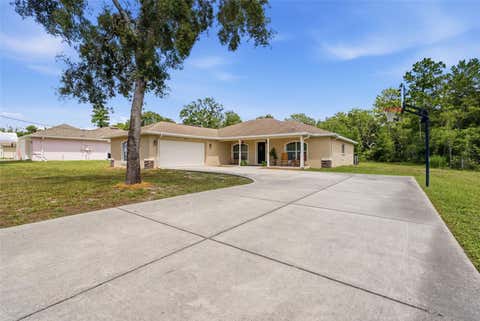 Photo of 11472 Pine Warbler Avenue, Brooksville, FL 34614 (MLS # O6415088)