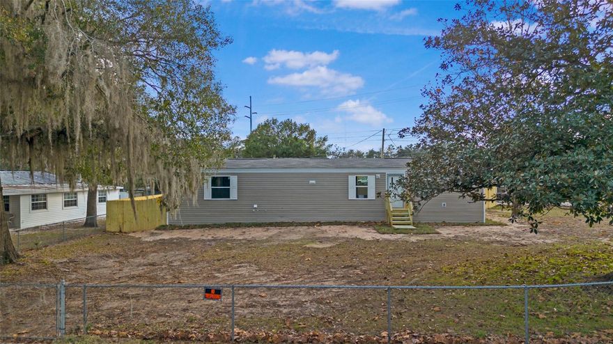This corner lot in southeast Ocala presents an exceptional opportunity to own a brand-new 2025 Clayton Shetland manufactured home, constructed to the highest modern standards. This residence showcases contemporary design with updated systems, energy-efficient features, and stylish finishes throughout.Highlights include a dedicated interior laundry room with dehumidifier hookup, Wind Zone 3 rating for enhanced durability, an E-home smart thermostat, heat pump, low-E windows, the highest flooring, wall and attic R Values in its class and additional quality appointments that prioritize comfort and efficiency. The property offers the freedom of no HOA or lot fees, with a chain-link fenced front yard and a privacy fence enclosing the rear yard for added seclusion. A spacious workshop building provides ample storage and versatility, complete with the well hookup, a separate laundry area equipped with electric and water connections, and plenty of room for tools, equipment, or recreational items. Perfectly positioned on a residential lot in a well-established area of southeast Ocala, this home delivers convenient access to shopping, dining, schools, and major roadways. For anyone seeking a newly built manufactured home that combines today's efficiency, modern amenities, and low-maintenance ownership in a desirable Florida location, this property represents a truly outstanding choice.