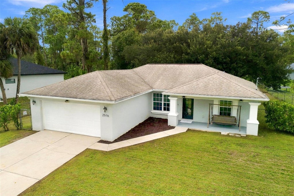 Photo of 2516 33rd Street W, Lehigh Acres, FL 33971 (MLS # A4707209)
