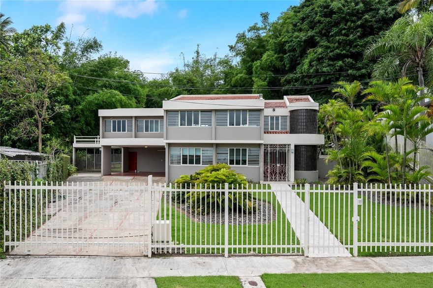 This residential property showcases a stunning contemporary design, spread across two levels and featuring an impressive backyard complete with a swimming pool. Having undergone a complete remodel in the 90s, the home boasts approximately 3,305 sq. ft. of living space situated on a generous 1,075 sq. meter lot.

Key highlights include:

- **Living Space**: 4 bedrooms and 4 bathrooms, along with an additional home office and a large laundry room located on the second floor.
- **Master Suite**: Spacious master bedroom equipped with a large walk-in closet and a luxurious bathroom featuring a spacious shower, toilet, bidet, and vanity.
- **Kitchen**: A modern kitchen with stainless steel appliances.
- **Outdoor Spaces**: A concrete terrace measuring around 900 sq. ft., spacious enough for gatherings, with a bar, storage space, and an exterior full bathroom. There's direct access from the terrace to the living, family, and kitchen areas.
- **Garage**: Two covered garages with a total capacity for 4 cars, with one conveniently located next to the kitchen entrance.

**Finishes and Equipment**:
- Marble floors in main living areas
- Split A/C units for climate control
- Security windows and doors for enhanced safety
- Water cistern and full power generator for convenience
- Alarm system for added security

**Community Amenities**:
- 24-hour gated community access
- Recreational and sports park nearby