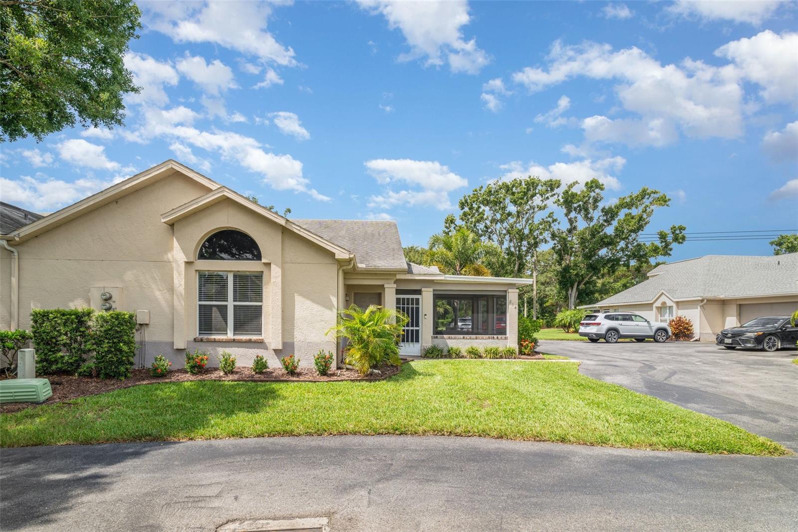 Welcome to this charming 2 master suite and 2 bath condo located in the Fairway Palms Community. The community offers maintenance free living with no age or pet restrictions. When you walk into the home you will notice the soaring vaulted ceilings and the lovely hard wood floors. This homes A/C was replaced in 2023 and the water heater was replaced in 2022.