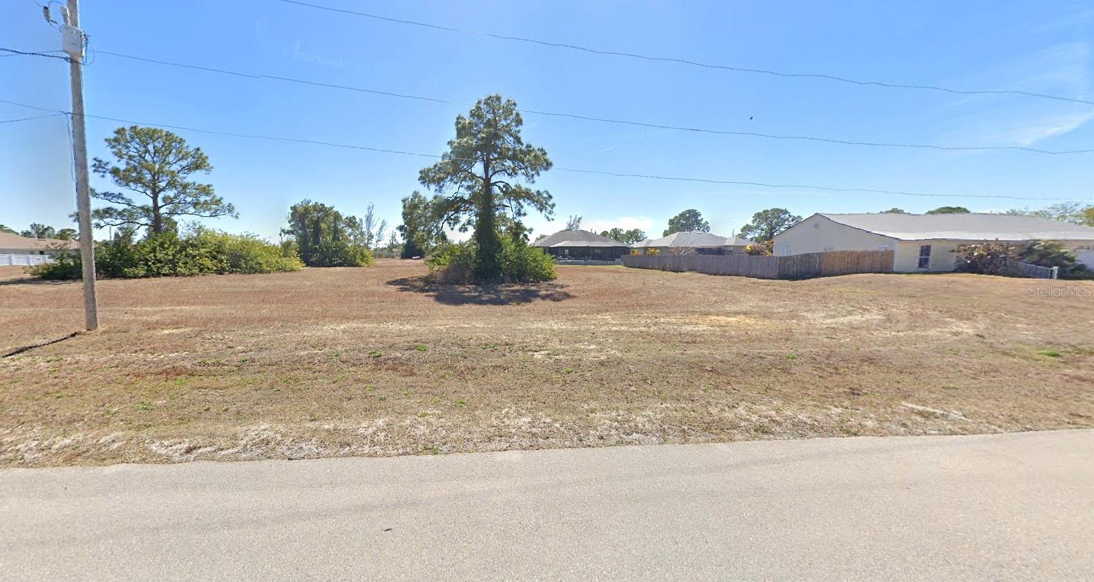 MORE PHOTOS COMING SOON!!! VACANT TRIPLE LOT IN NW CAPE CORAL – .34 ACRES! Incredible opportunity to build your dream home or invest in one of the most desirable and fast-growing areas of Cape Coral. This oversized triple lot (approx. .34 acres) is mostly cleared and ready for development, offering extra space for a pool, 3-car garage, or custom outdoor living area. Located in Flood Zone X (no flood insurance required), this property provides peace of mind and long-term value. Zoned R1-W (single family residential), it offers flexibility for your custom design. City water and sewer services are not yet in place, keeping taxes and assessments lower until you’re ready to build. Conveniently situated just 10 minutes from Burnt Store Marina, where you’ll enjoy boating, fishing, dining, and a community boat ramp. Less than 20 minutes from Matlacha and Pine Island, famous for their art galleries, waterfront restaurants, unique shops, and world-class fishing. Everyday essentials, shopping, schools, and dining are also close by, giving you the perfect balance of peaceful living with modern conveniences. Whether you’re a builder, investor, or future homeowner, this property checks all the boxes — oversized lot, no flood zone, no HOA, affordable taxes, and prime NW Cape Coral location. Secure your piece of paradise today!