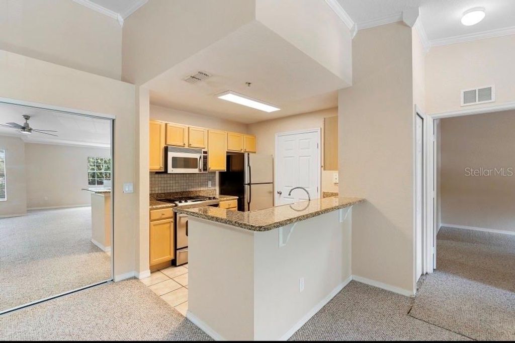 Photo of 910 Regatta Bay Drive #5-201, Orange City, FL 32763 (MLS # V4948293)