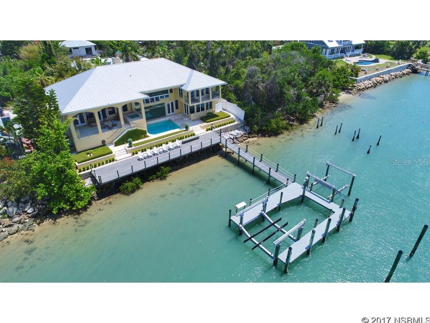 Only a discreet few homes are located along this most desirable part of the island. Indian River Rd is so special because it is a quiet street and the homes view all natural landscape over the river. The sunsets are like no other. There are so many attractive features about this home. An easy living floor plan allowing for all your guests to feel the privacy yet come together in all the various gathering places like the family room with soaring ceilings, the pool area with hot tub and large covered outdoor kitchen and the inside kitchen area with wet bar, island and large family gathering by the fireplace. The dock boasts enough space to host a large party as well. Bring your big boats because there is room for a 60 foot yacht, a 16,000 lb lift as well as a 24,000 lb lift. I doubt you could even build a dock like this today with the current restrictions. The master bedroom overlooks the river with it own private balcony. Spacious bedrooms along with an in law suite downstairs make for a comfortable environment for extended family. EXECUTIVE Office overlooks the River. Large laundry and tons of storage. The view facing west shall remain unspoiled for tons of privacy and the ultimate viewing of the best sunsets nature has to offer. Close to shopping and restaurants make this one of a kind exquisitely built home a pleasure to call home. ;Water: City