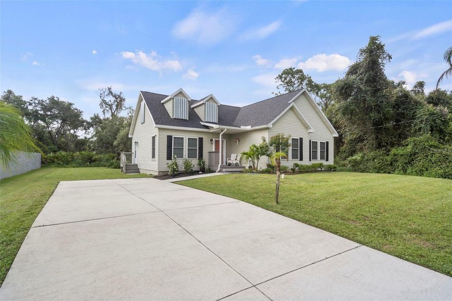 A Dream for Nature Lovers. Your new home is nestled among old historic oak trees and palms on a large lot in North Port. Enjoy biking and hiking trails with your pets in the neighborhood and picnic at Oaks Park just around the corner. Oaks Park trails are considered to be some of the best mountain bike trails in the area! Enjoy a spacious and roomy three bedroom, two-bath property that is bright and very welcoming. Entire home is freshly painted with new luxury vinyl plank flooring throughout. The spacious kitchen allows for a few cooks in the kitchen and designed for preparing meals and entertaining. The kitchen features stainless steel appliances, ample counter space, and a breakfast bar perfect for casual get-togethers. Let the dog in/out using the side door. The semi-open floor plan with 9ft ceilings and crown molding throughout seamlessly connects the kitchen and dining room but allows for gathering in the formal living room and great room creating a welcoming and inviting space for you and guests. You'll love the easy access to your deck with sliding doors from the kitchen and primary bedroom. Step outside to enjoy the expansive brand-new deck ideal for that cookout, relaxing, sun tanning or relaxing in a Jacuzzi hot tub! The home has been thoughtfully upgraded with both aesthetic and mechanical improvements, including a new roof, water system, water heater, appliances, fresh paint and beautifully tiled bathrooms. You will have AMPLE CLOSET space in the bedrooms and the beautifully refinished stairs leads to a huge attic space which can be used for a second en-suite, storage or home theater (rough plumbing located upstairs). Set on a large lot & driveway - big enough for that boat and with new NP street parking rules – no need to park on street – there is parking for at least six cars! Perfect as a second home for snow birds! Very convenient location - I75, Police, Fire and Post Office, Schools, Aquatic Center, Community Centers and Local Shopping! There is NO HOA or CDD!