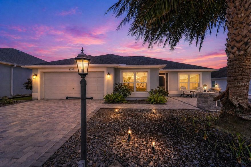 Welcome to the Village of Pine Hills, where this beautifully maintained JASMINE MODEL (3 BEDROOM, 2 BATH) offers the perfect blend of comfort, style, and investment potential with TURNKEY option available separately.

As you arrive, you’re immediately greeted by standout curb appeal with a PAVERED DRIVEWAY and a spacious PAVERED FRONT PORCH—an inviting place to enjoy your morning coffee. The SCREENED-IN FRONT ENTRY adds both charm and functionality, allowing you to enjoy Florida breezes year-round. Step through the entrance and into a welcoming FOYER that opens to a light and airy OPEN FLOOR PLAN featuring LUXURY VINYL PLANK FLOORING and VAULTED CEILINGS.

To your left, the kitchen offers a functional and welcoming space with OAK SOFT CLOSE CABINETS, PULL OUT SHELVING, HD LAMINATE COUNTERTOPS, and a beneficial KITCHENETTE AREA perfect for casual dining. The KITCHEN BAR with STOOL SEATING overlooks the seamless DINING AND LIVING ROOM COMBO, making this layout ideal for entertaining or everyday living. Just beyond, SLIDING GLASS DOORS lead you to the ELEVATED LANAI, where you can unwind while enjoying a slight WATER VIEW to the right—a peaceful backdrop for relaxing evenings. The lanai is enhanced with SUNSHADES and an additional OUTDOOR GRILLING AREA, creating the perfect indoor-outdoor lifestyle The Villages is known for.

The split floor plan provides privacy and functionality. The PRIMARY SUITE is thoughtfully positioned and features a LARGE WALK-IN CLOSET and an EN-SUITE BATH with DUAL VANITY SINKS and a ROMAN SHOWER. On the opposite side of the home, BEDROOMS TWO AND THREE offer comfortable accommodations with BUILT-IN CLOSETS and easy access to the SECOND FULL BATH, with a pocket door providing added PRIVACY for your guests.

Additional highlights include an INDOOR LAUNDRY ROOM with WASH TUB AND STORAGE, a TWO-CAR GARAGE that has been PAINTED and SEALED, GUTTERS, and UPGRADED LIGHTING throughout. This home is BLOCK AND STUCCO construction, built in 2017, with a NEW ROOF (2026) offering peace of mind for years to come.

Currently set up as a successful RENTAL PROPERTY on Airbnb and VRBO, this home offers a fantastic opportunity for both personal use and INCOME POTENTIAL.

Conveniently centrally located just minutes to Okeechobee Executive and Belle Glade Championship Golf Course, and the Moyer Recreation Center, Atlas Canine Park —with neighborhood pools just around the corner. Enjoy a short golf cart ride to Brownwood, Lake Sumter Landing, and Spanish Springs Squares all within 8 miles. 

Whether you’re looking for a full-time residence, seasonal retreat, or investment property, this JASMINE MODEL checks all the boxes—schedule your private showing today and experience it for yourself.