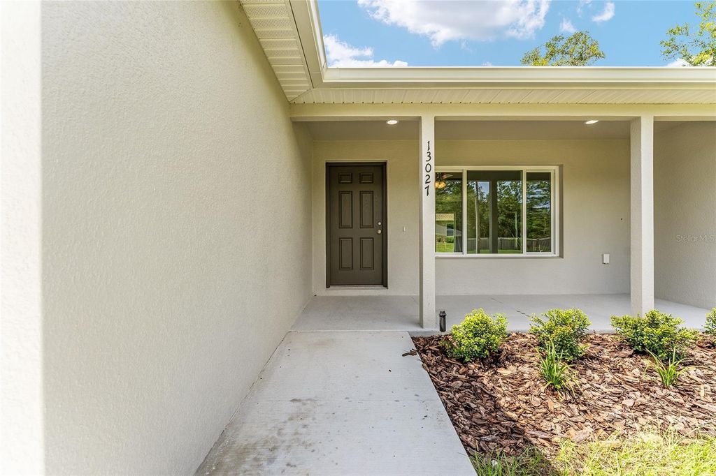 Photo of 497 Fisher Way, Ocklawaha, FL 32179 (MLS # O6352927)