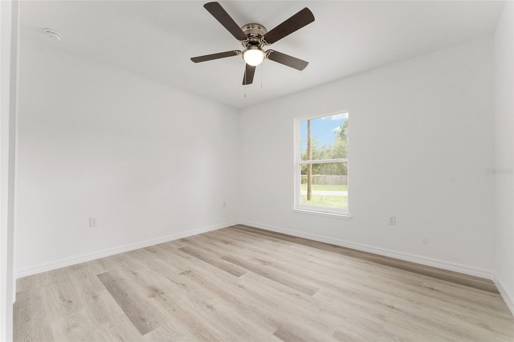 Photo of 497 Fisher Way, Ocklawaha, FL 32179 (MLS # O6352927)